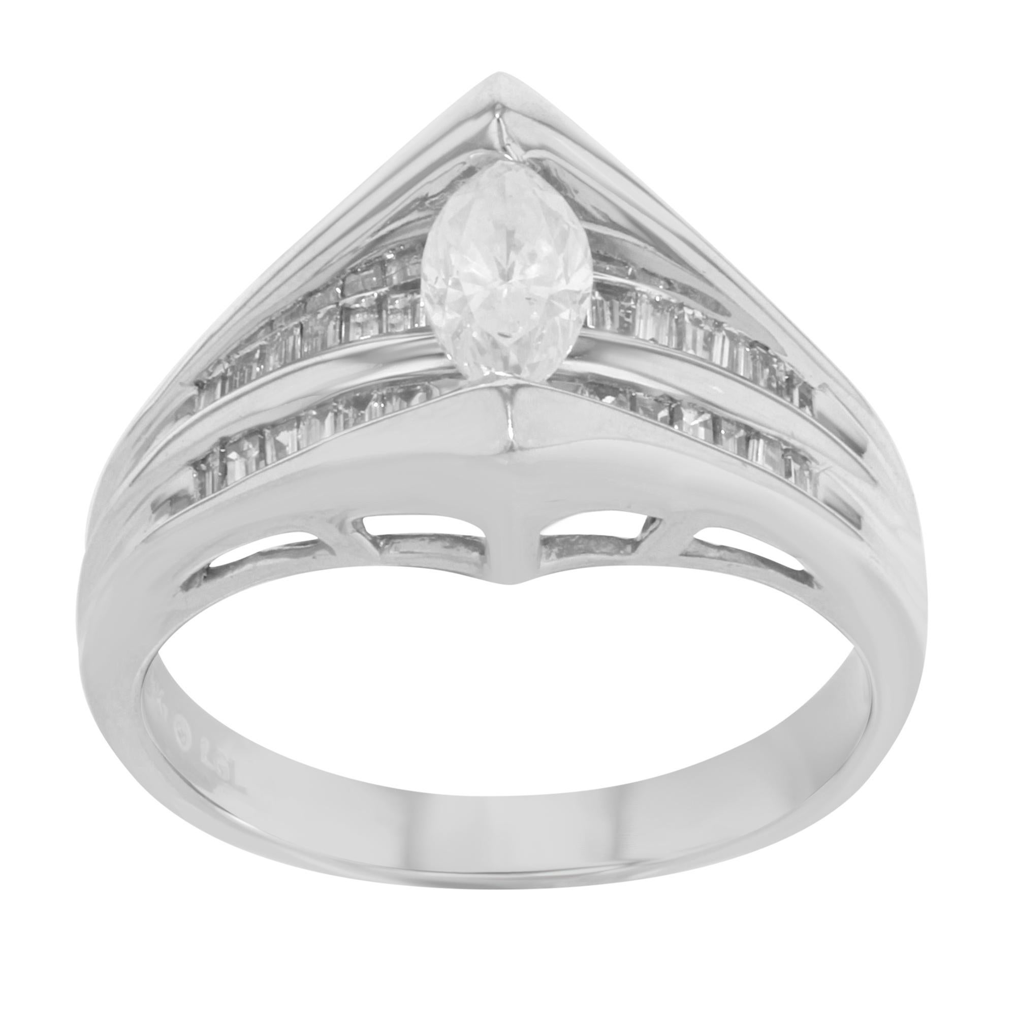 This beautiful ring is crafted in 14K white gold. It features a center marquise cut cloudy diamond accented with channel set baguette cut white diamonds. Total diamond weight 1.25 Cttw. Ring size 7. Total weight: 5.8 gms. Comes with a gift box and