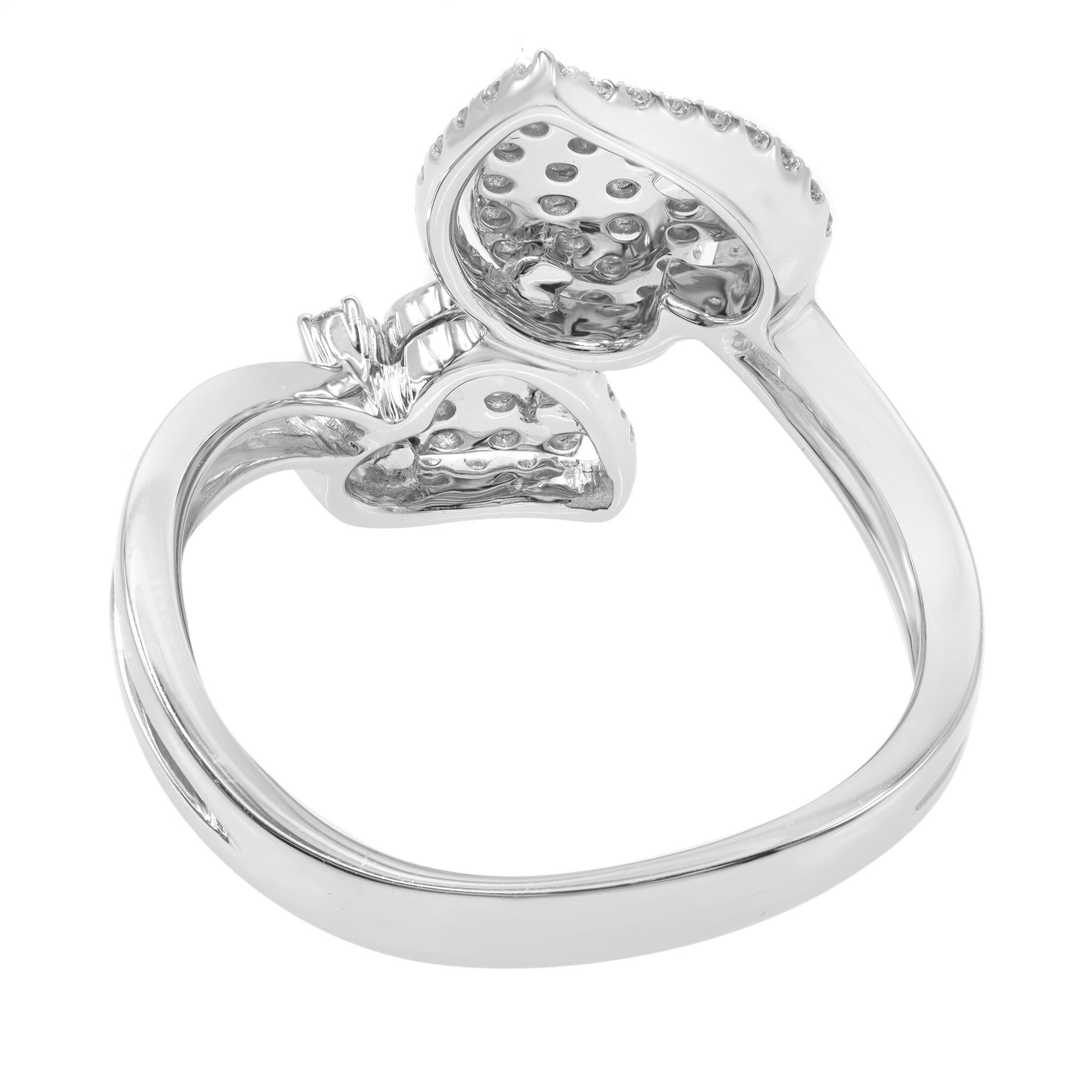 Rachel Koen double heart diamond ring crafted in 18k white gold. This ring features brilliant round cut diamonds pave set in heart shape shanks. The total diamond carat weight is 0.53 with color G-H and clarity VS-SI. Ring size: 7. Comes with a