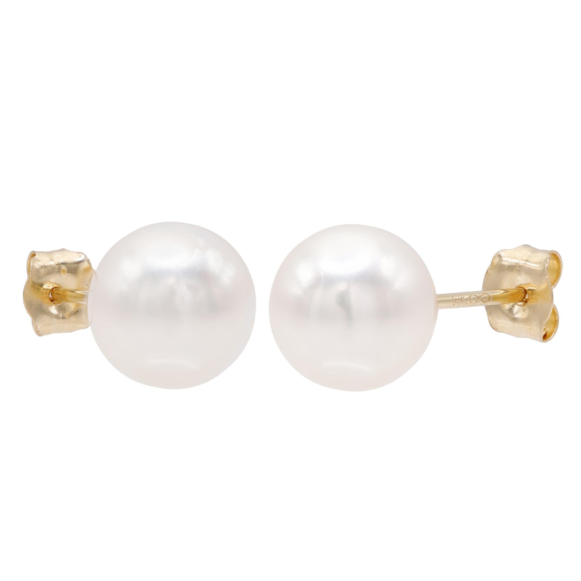 Simple and elegant, these pearl stud earrings are a must have accessory. Showcasing white fresh water pearls. These earrings are crafted in 14k yellow gold. Secured with push back posts. Earring size: 7.3mm. Total weight: 1.38 grams. Makes a perfect