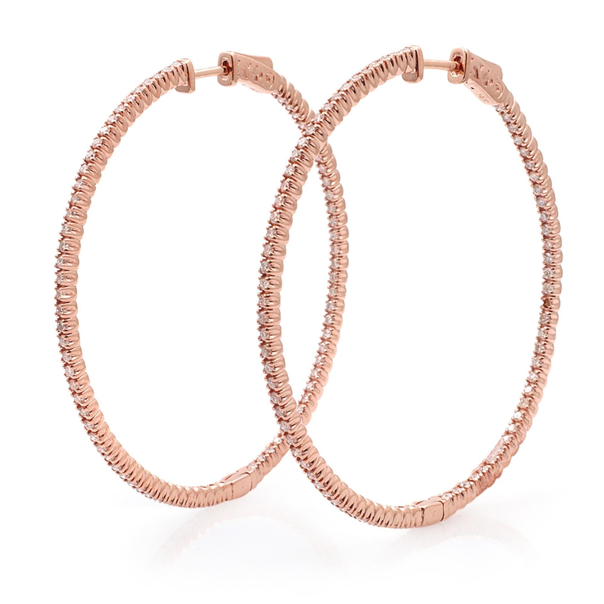 This stylish and elegant 14k rose gold hoop earrings feature prong-set round diamonds in a single line. The diamonds embellish these earrings on the inside and the outside, offering a dazzling look from every angle. Total carat weight 1.65cttw.