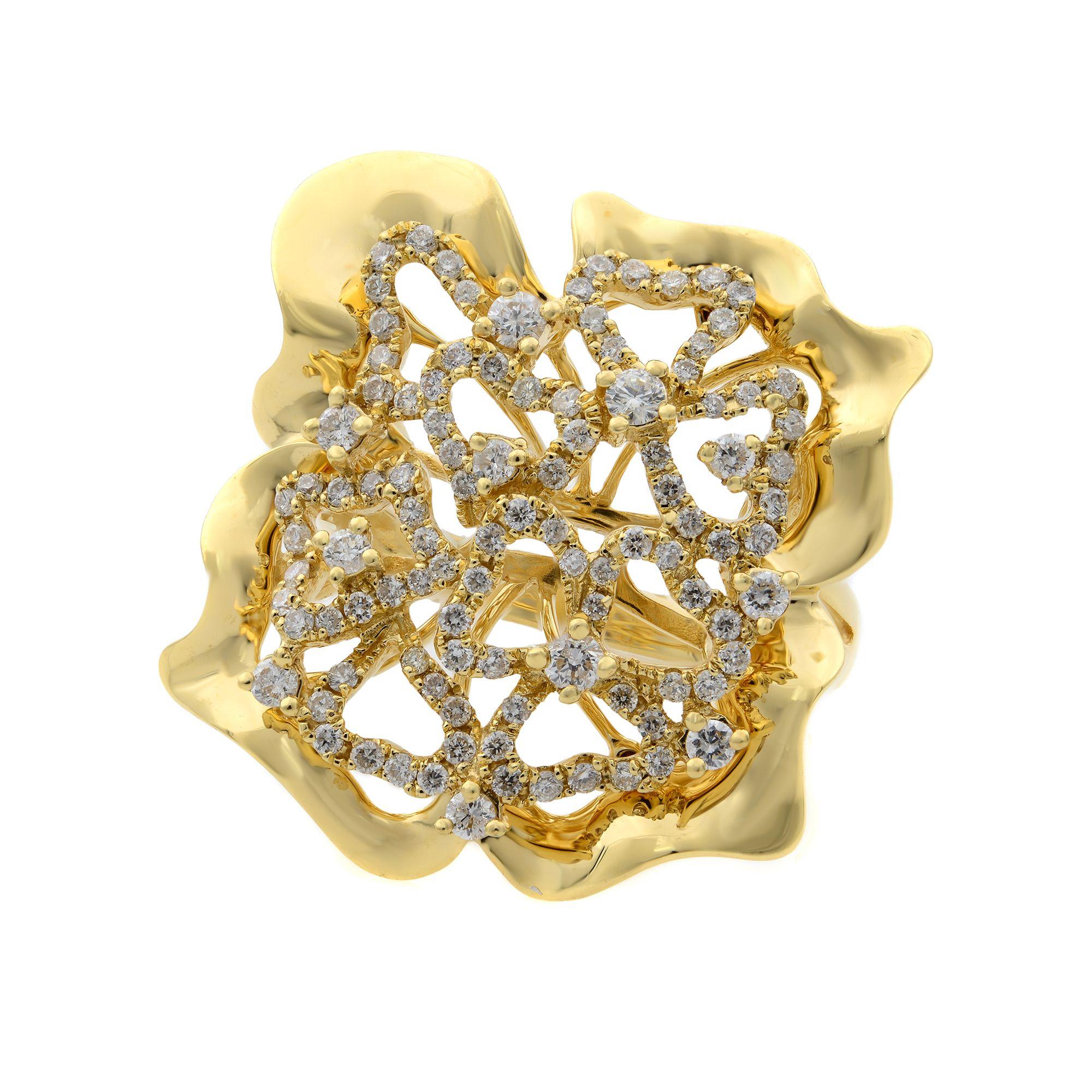 The beautifully unique ring is crafted in 18k yellow gold and showcases an intricate floral design adorned with pave and prong set round cut natural diamonds. Total carat weight is aprox. 0.75. Top measurements 1 inch. Ring size 6.75. Comes in our