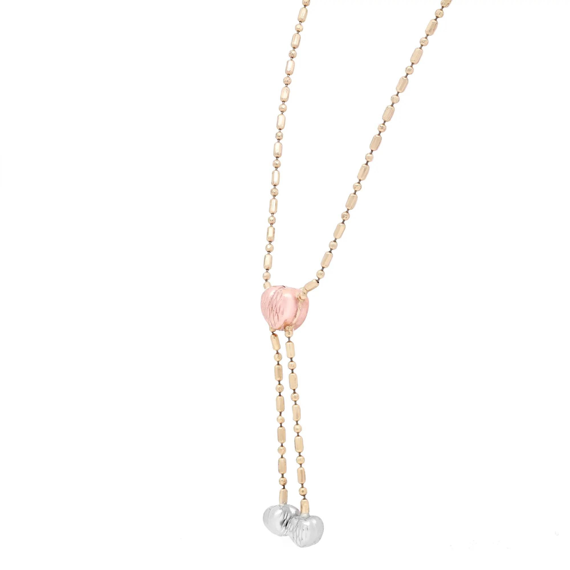 This classic lariat multicolor gold chain is handcrafted in highly gleaming 14K yellow, rose, and white gold. The chain features an embossed rose gold heart pendant with two hanging embossed white gold hearts. Chain length: 16 inches. Total weight:
