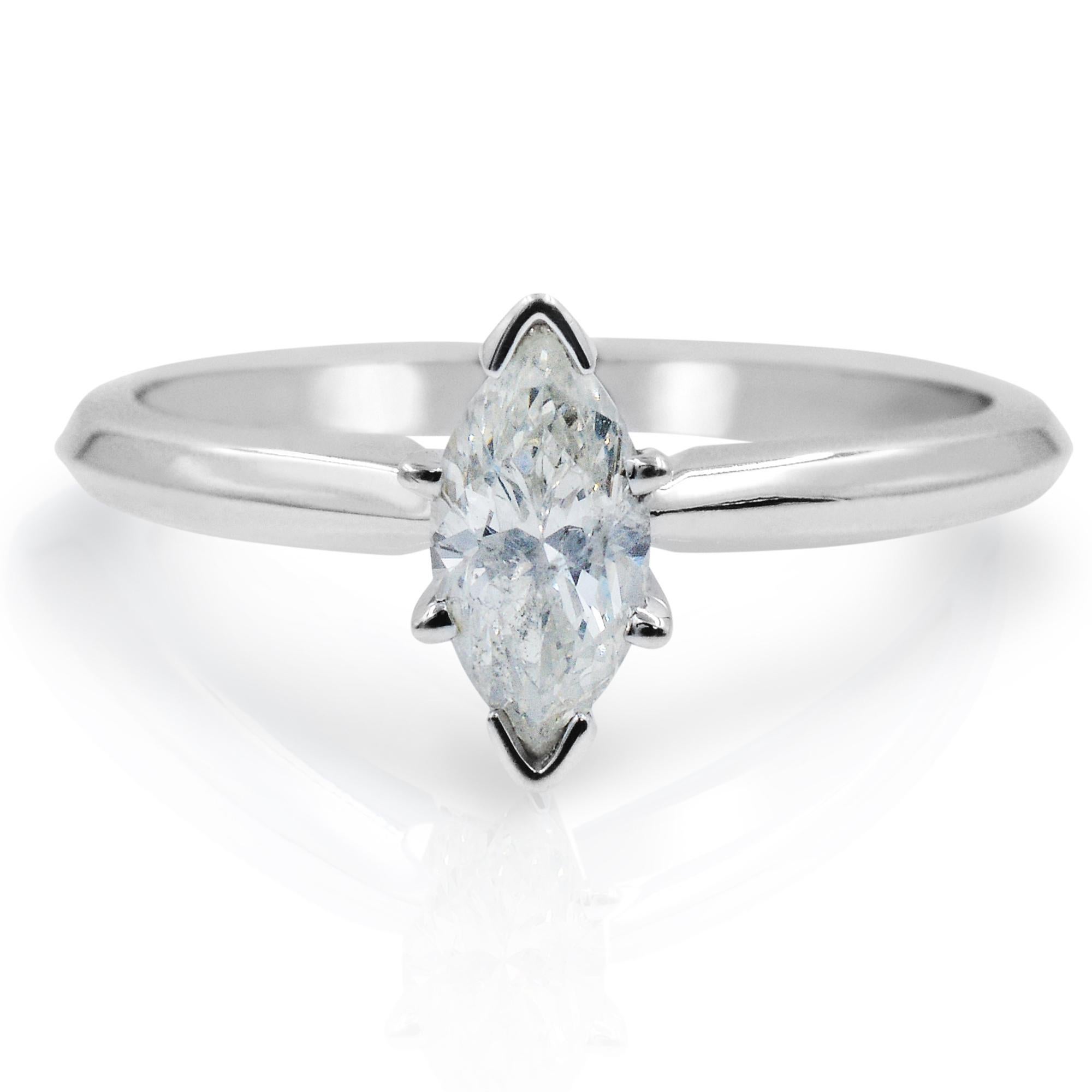 This beautiful solitaire engagement ring crafted in 14k white gold features a prong set marquise cut diamond weighing 0.47 carat. Looking back in the 1700's, the marquise cut diamond has been a stand out for centuries. Diamond Quality: G-H color,