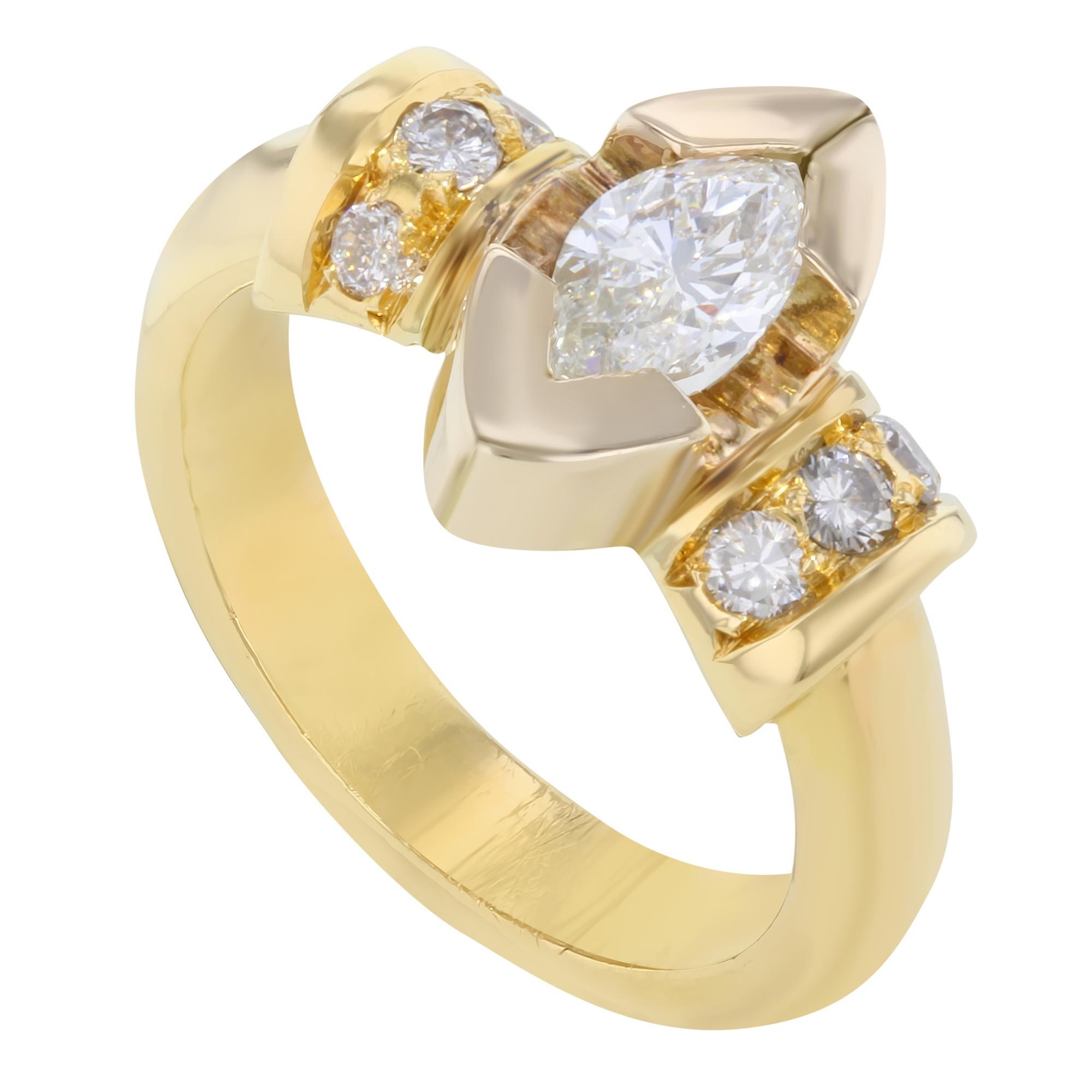Classic and gorgeous, yellow gold marquise cut diamond engagement ring. This ring features a sparkling diamond in the center weighing 0.75ct in a half bezel setting and tiny round cut diamonds on each side giving a stunning vintage look. Total