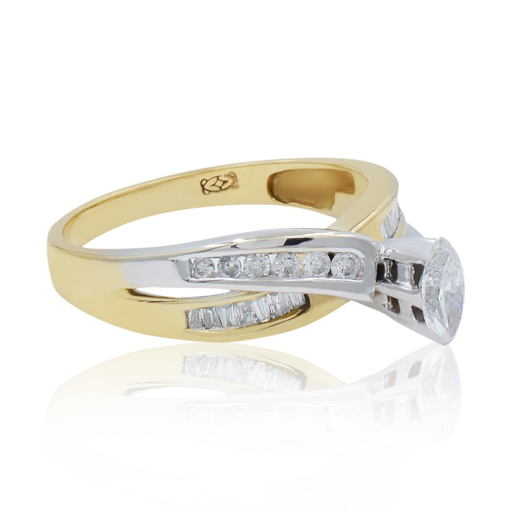 Beautiful two piece set: engagement ring and wedding band for the price of one. This beautiful ring features a marquise center diamond accented with a row of round cut diamonds in white gold and a row of baguette cut diamonds in yellow gold. The