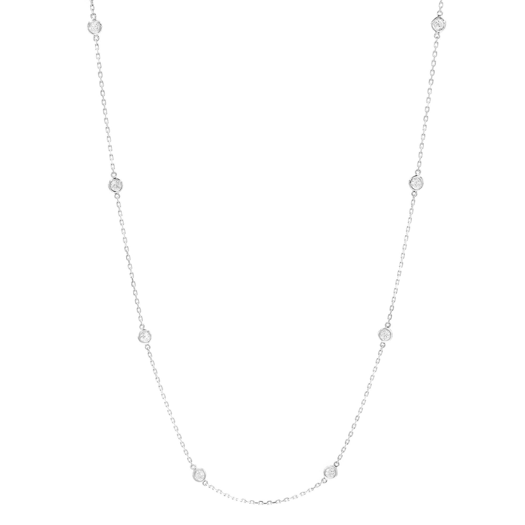 (05945) 

Stunning custom design 14k white gold natural diamond by the yard necklace. Bezel set with 10 round brilliant diamonds weighing 0.70cttw. Diamonds are nearly colorless with G-H color, and VS-SI clarity. Chain length: 18 inches. Comes with