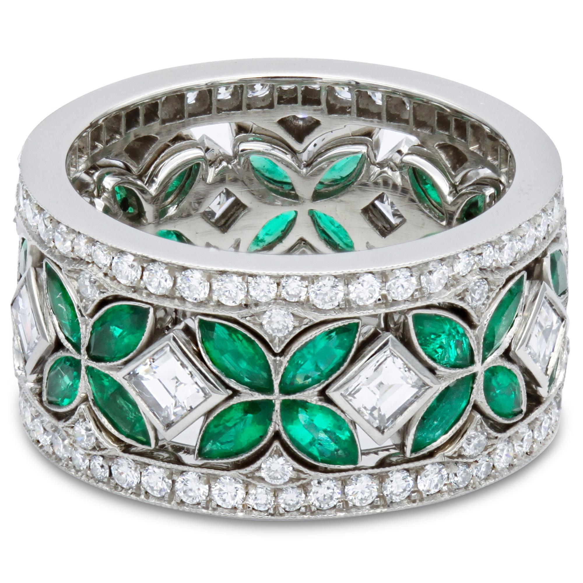 We take great pride in offering this fabulous platinum diamond eternity band that is actually three in one. The center row is a ring that sparkles all around with natural green emeralds and rare art deco carre cut diamonds. Seamlessly set in bezel