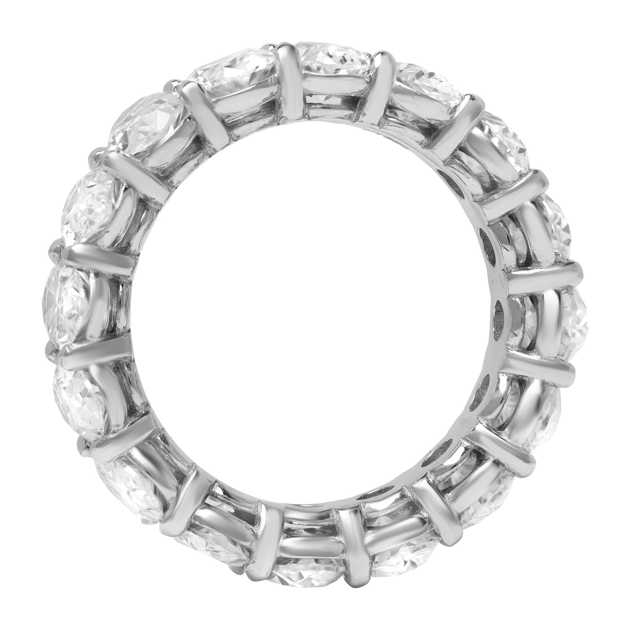 This 6.77cttw oval eternity ring celebrates the power of love with breathtaking brilliance set within the enduring luster of platinum. Prong set with a total of 16 excellent cut oval stones. Diamond color F and VS1 clarity. Width: 6.30mm. Ring size