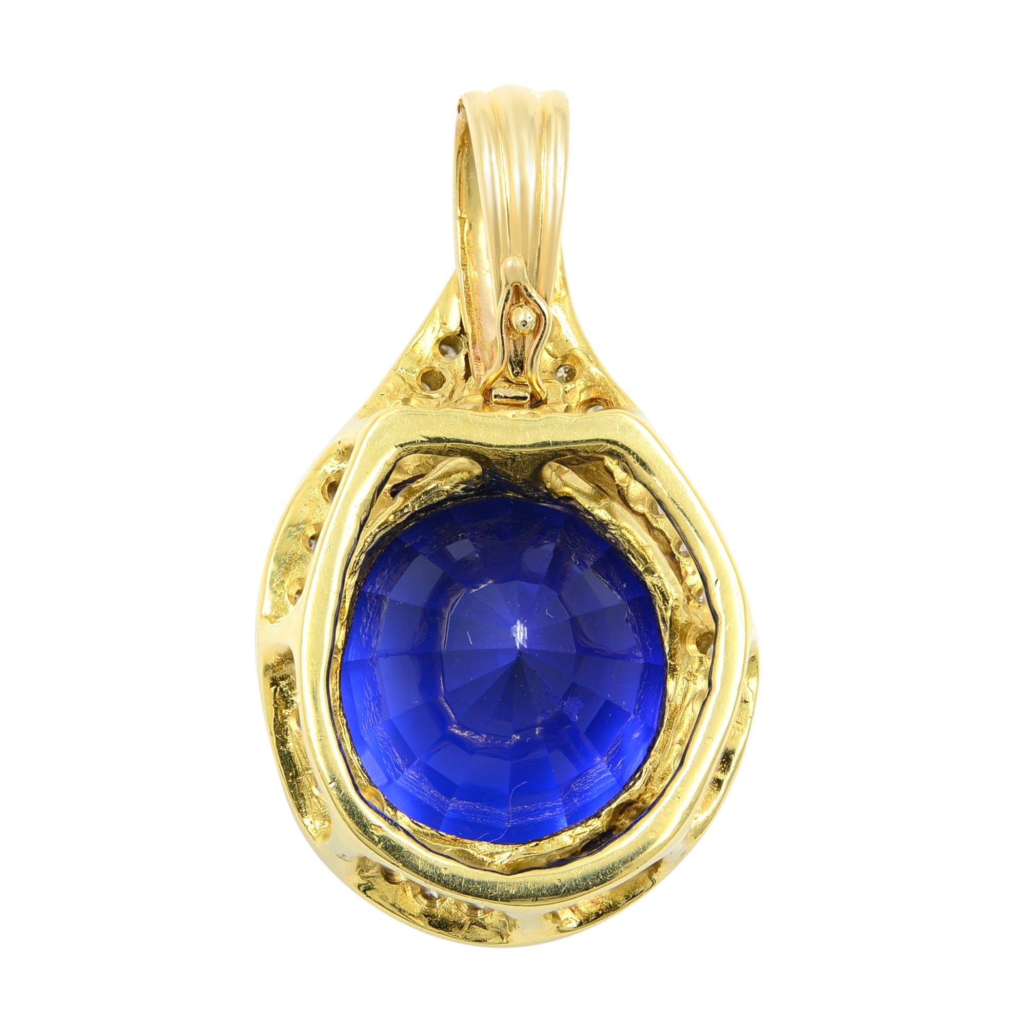 This knockout jewel astounds your senses with an extra-radiant, deep, rich blue color, round cut Tanzanite - weighing 27.66 carats. The uniquely stunning and vibrant gemstone is surrounded by brilliant-cut diamonds set in 14 karat yellow gold. This