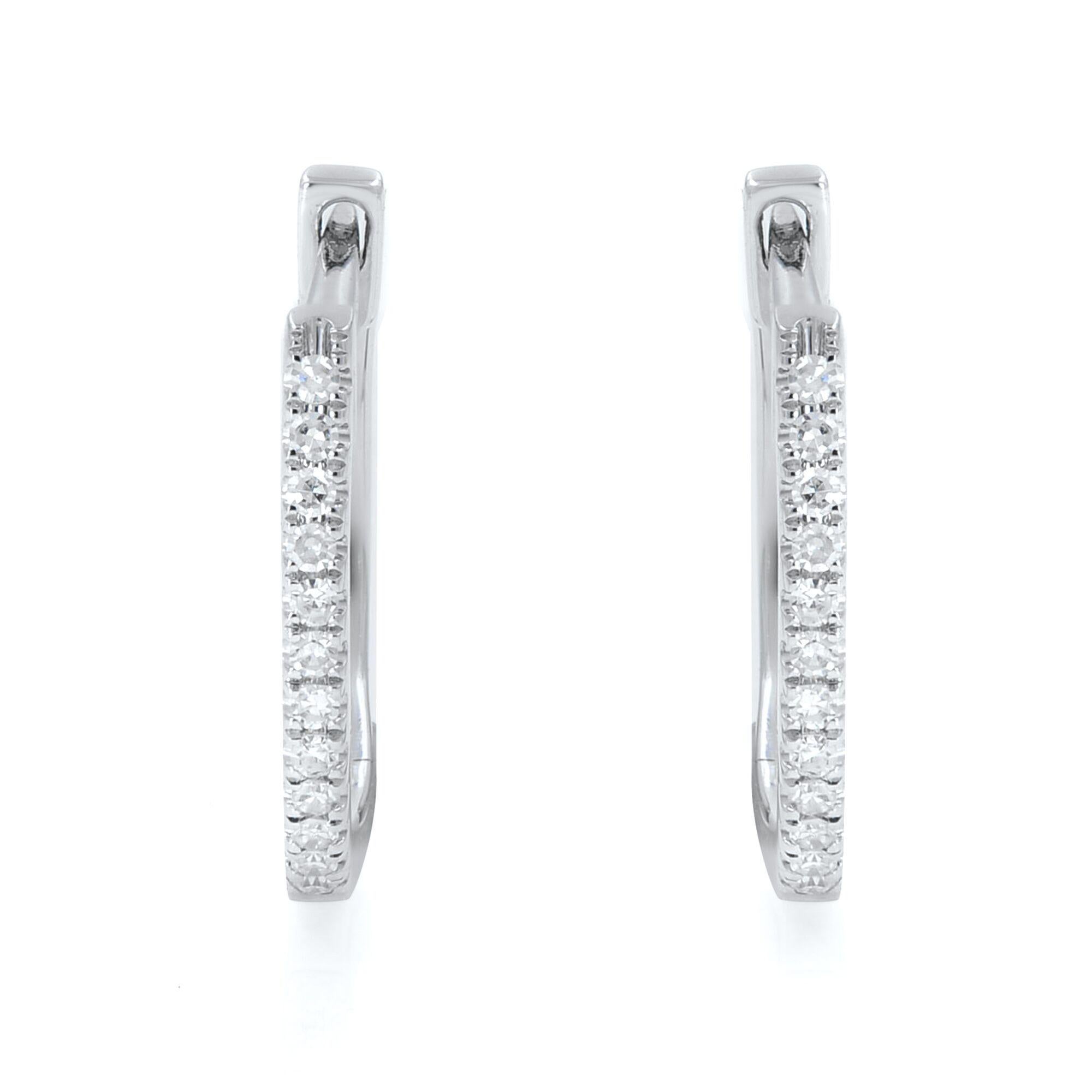 Sleek and classic, a timeless pair of diamond huggie hoop earrings, perfect for a great everyday look. These hoop earrings are crafted in 14K white gold and encrusted with round cut diamonds weighing 0.08 carat. Diamond color G-H and clarity VS-SI.