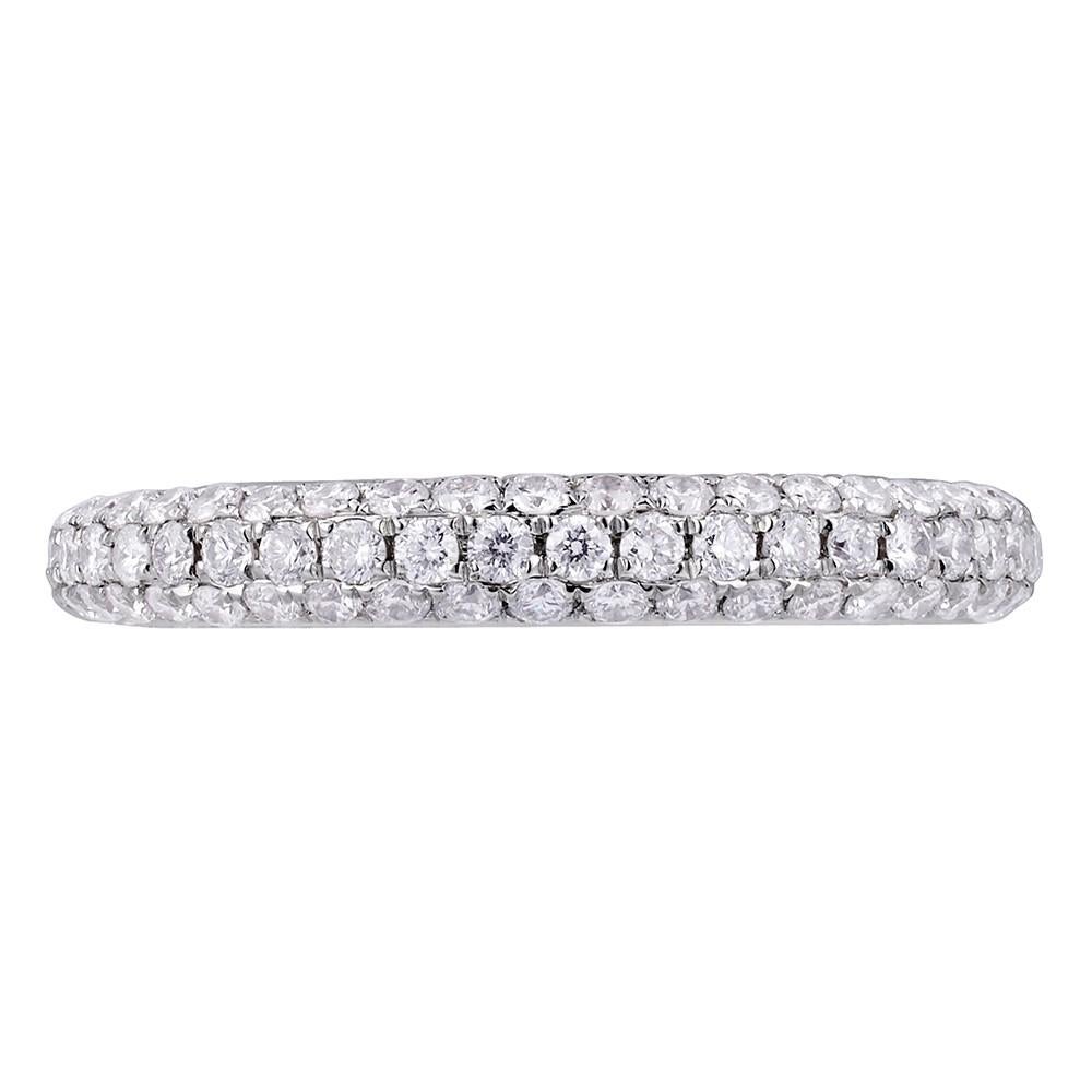 Presenting a modern and elegant ladies wedding band. This sparkling 18k white gold ring is highlighted with 0.73cttw of dazzling white round cut pave set diamonds. Diamond clarity VS-SI and F-G color. Size 6.5. Comes with a presentable gift box. 