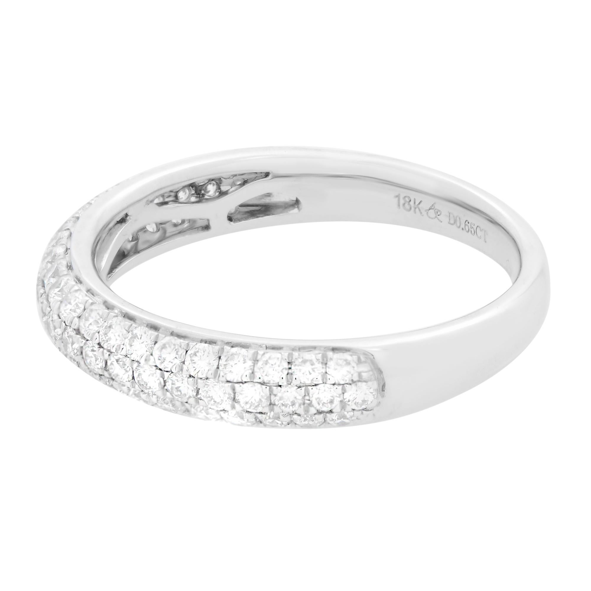 While the design of wedding rings is becoming more modern in many cases, the tradition and symbolism of the ring is as strong today as it's ever been. Presenting a luxury and modern design, this sparkling 18K white gold wedding band is set with