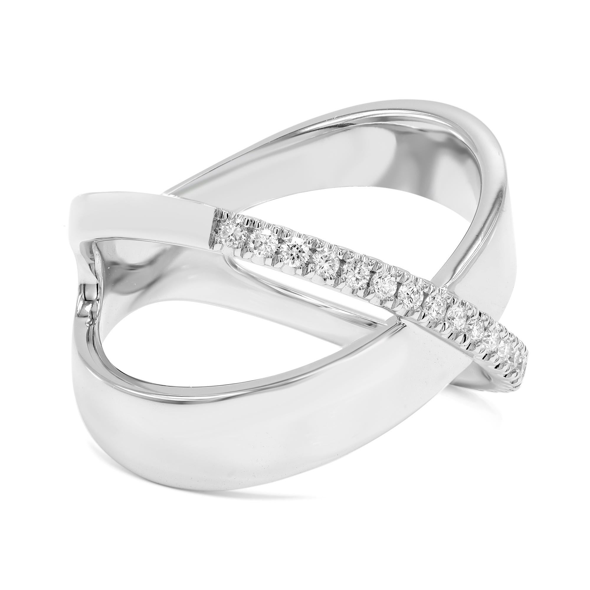 This amazing high polish 14k white gold X Criss Cross ring is accented by a line of pave round cut diamonds along the top of the ring. The total diamond carat weight is 0.19. Diamond color G-H and VS-SI clarity. Ring size 7. Width: 13.7mm. Weight: