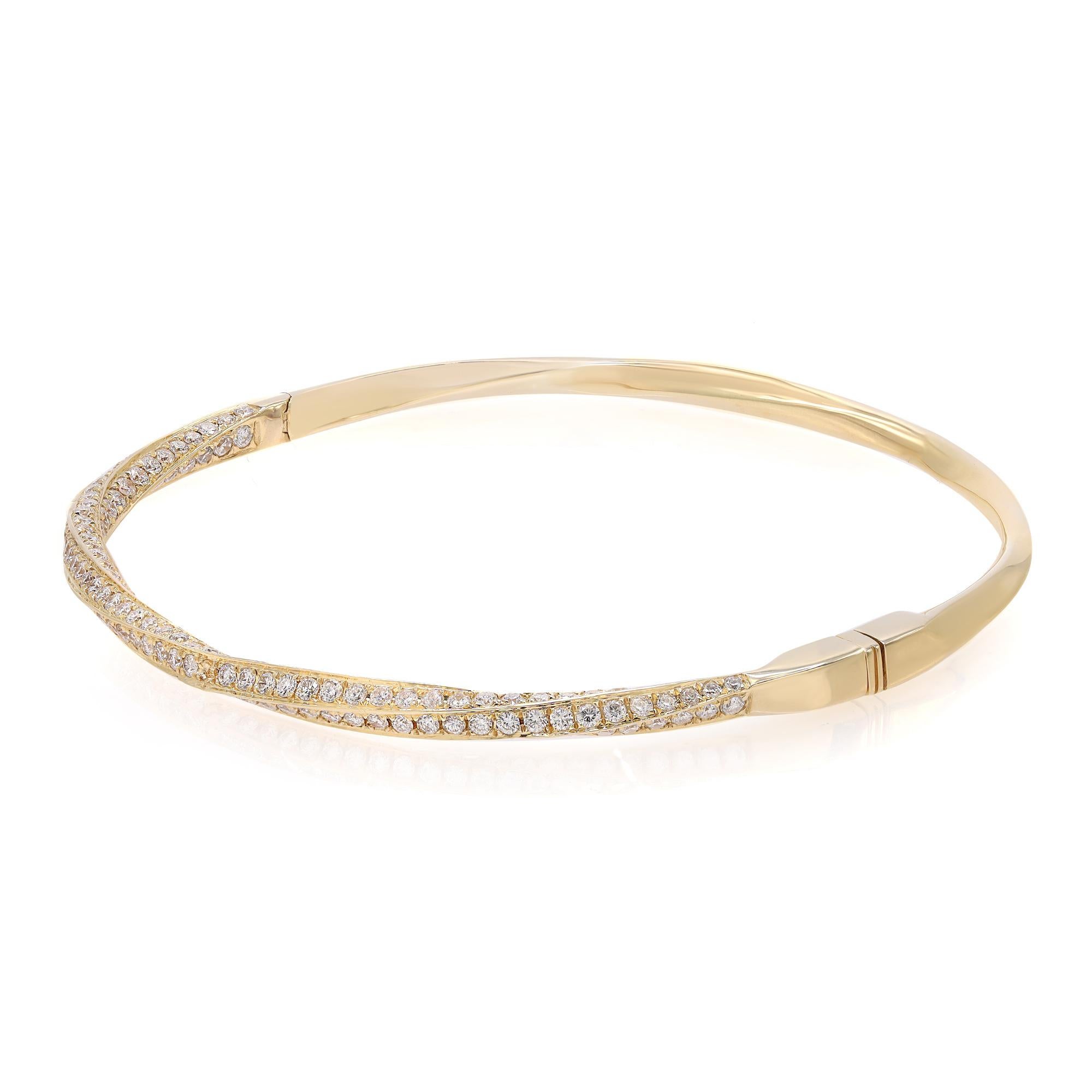 This beautifully crafted bangle bracelet features pave set round brilliant cut diamonds encrusted halfway through the bangle. Crafted in 18k yellow gold. Total diamond weight: 2.05 carats. Diamond Quality: F-G color and SI clarity. Wrist size: 6.5