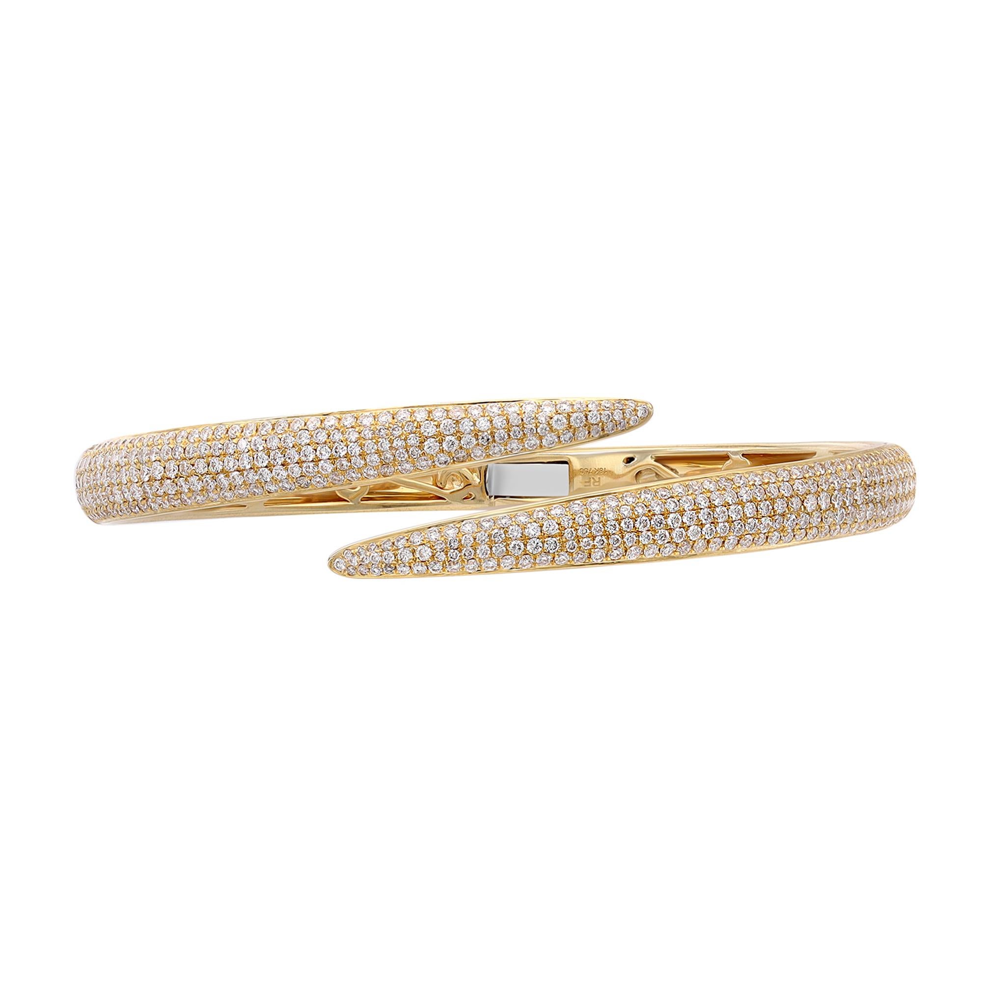 A classic look with easy elegance, this diamond bangle bracelet exudes sophistication. This stunning bracelet is crafted in 18k yellow gold and features pave set tiny white round cut diamonds with a total weight of 2.70 carats. Diamond color G-H and
