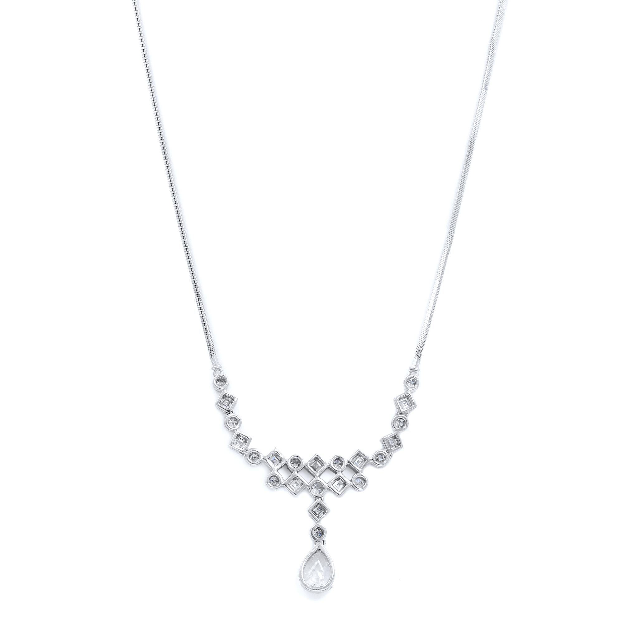 This beautiful necklace is encrusted with vintage cut pear, round and carre shape diamonds crafted in 18K white gold. Center pear shaped diamond weighs 1.20 carats with an open culet that looks great and makes a statement while round and carre shape