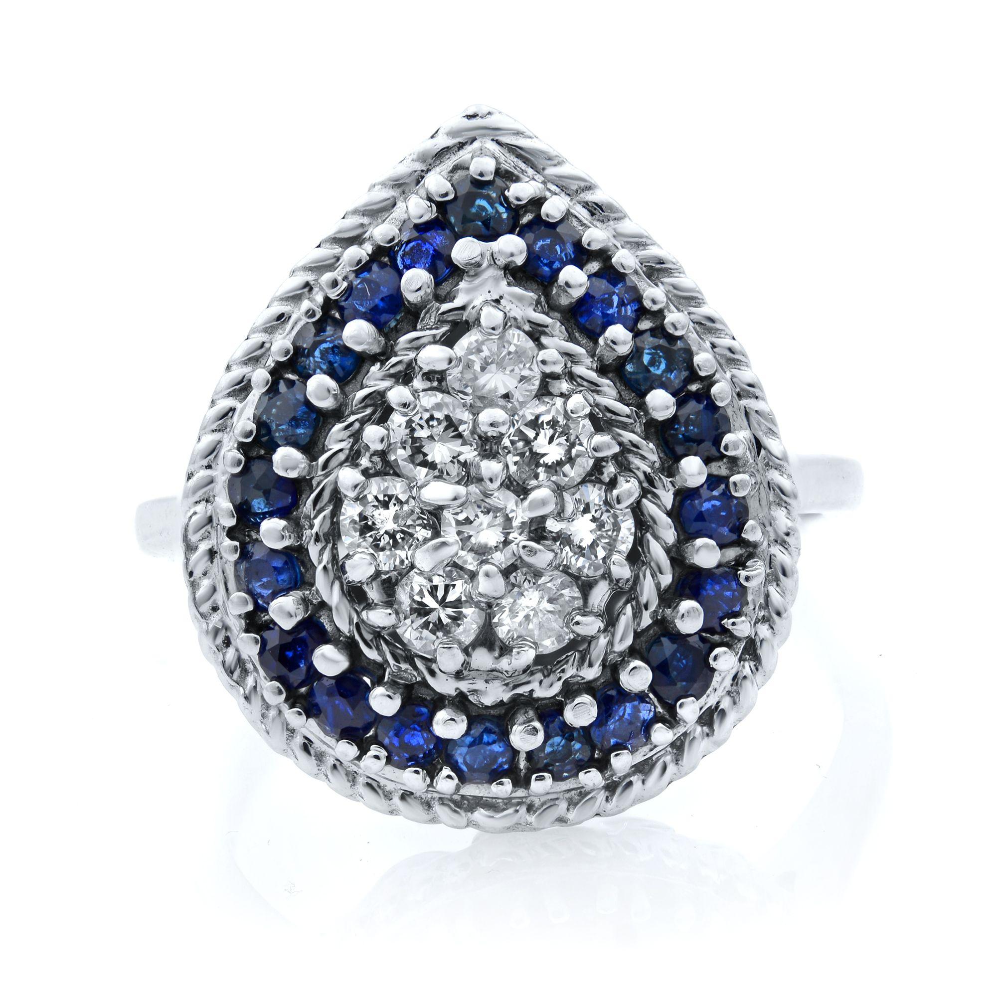 A truly remarkable cocktail ring for the woman who's anything but ordinary. A pear-shaped center is set with 0.32cttw sparkly white diamonds which is the gorgeous focal point. Halo is set with 0.30cttw of natural sapphires. This ring is crafted in
