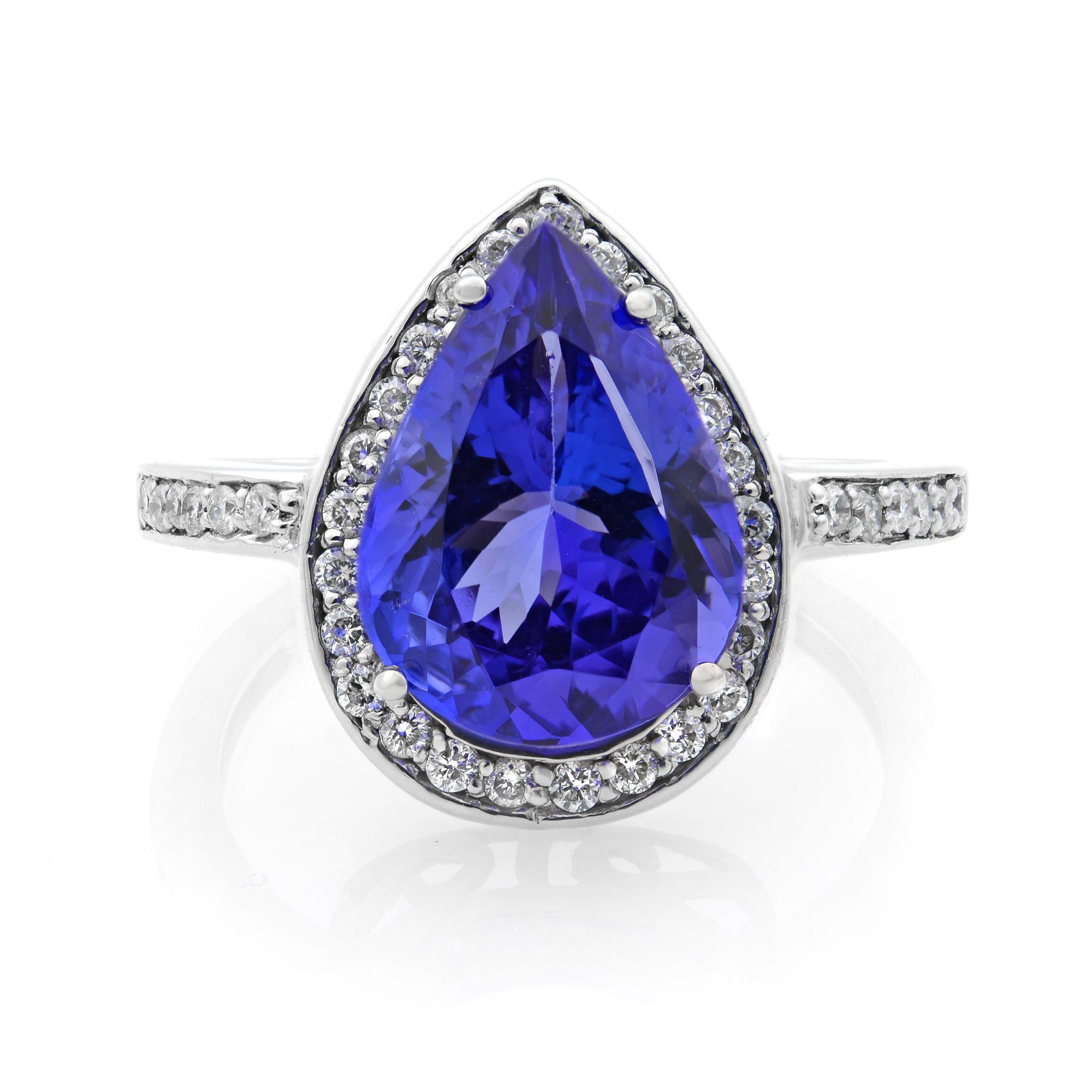 Give your fine jewelry collection a touch of glamour with our stunning tanzanite and diamond ring, featuring a dazzling pear shaped 3.00 carat tanzanite center stone beautifully held in a classic setting and surrounded by a glistening halo of 0.50