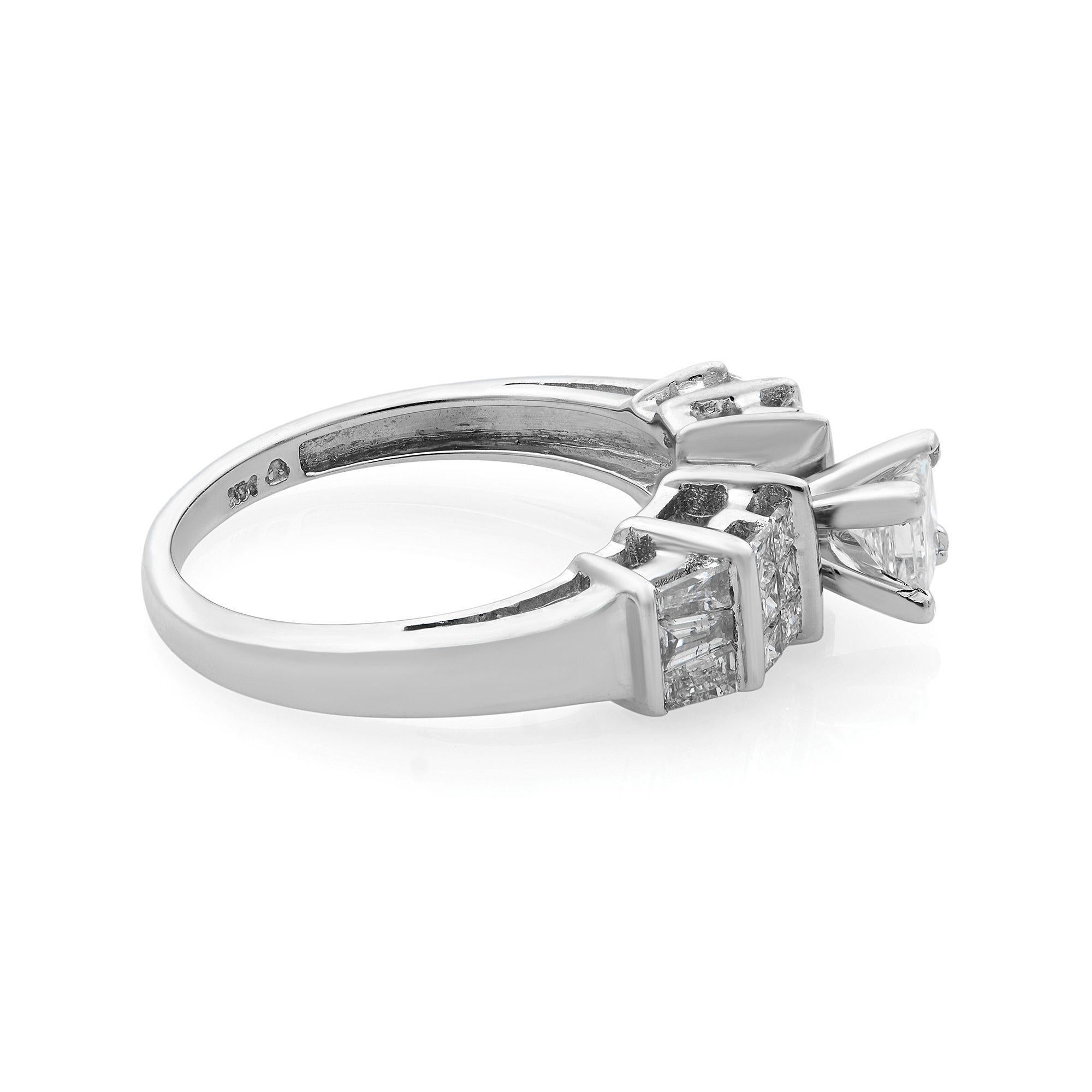 Princess cut diamond engagement ring with baguette cut side stones crafted in 14K white gold. Truly a stunning treasure, the captivating 0.40 princess-cut diamond at the center sparkles brightly in a four-prong setting. Accenting the shine,