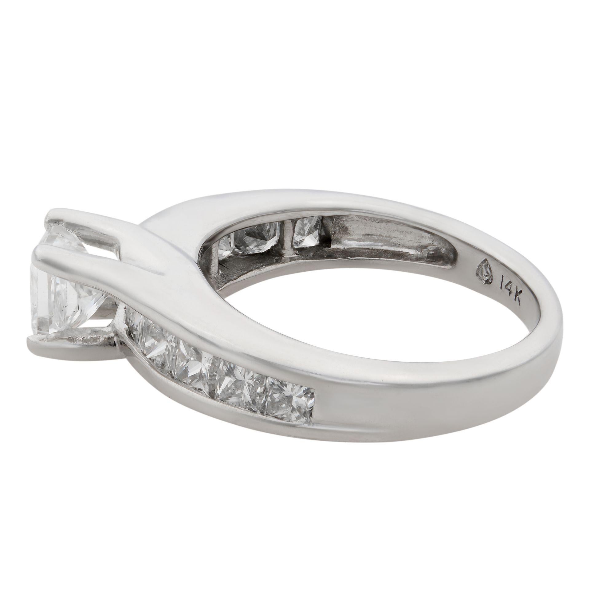 This stunning princess cut diamond engagement ring is too good to pass by. Crafted in 14k white gold, it features a 0.45ct princess cut diamond in the center of this elegant princess cut engagement ring. 
Either side of this beautiful ring is