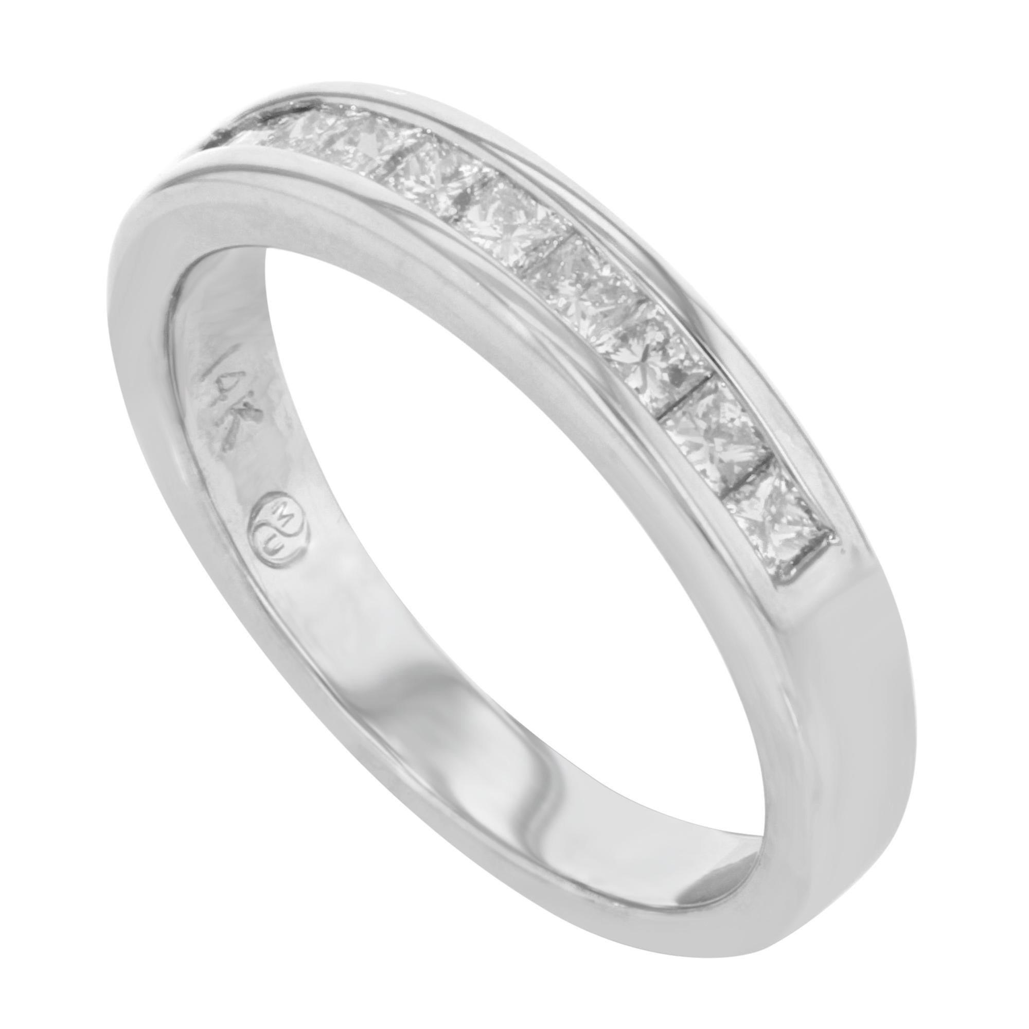 Stunning diamond wedding band with princess cut diamonds. Total of 10 stones weighing 0.75 cttw. Crafted in high polished 14K white gold. This eternity band features channel set design that can be worn as a beautiful wedding band, or simple princess