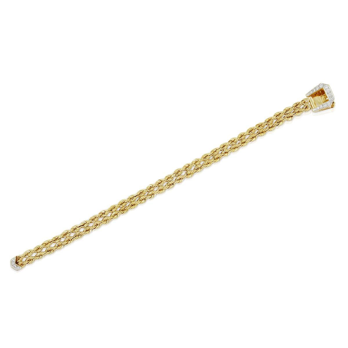 Luxe and ultra-comfortable on the wrist, fine woven mesh bracelet flashes diamonds on the lock. This unique piece is crafted in 14k yellow gold. The buckle is set with round cut diamonds. Total carat weight: 0.36. Length: 7 inches. Total weight: