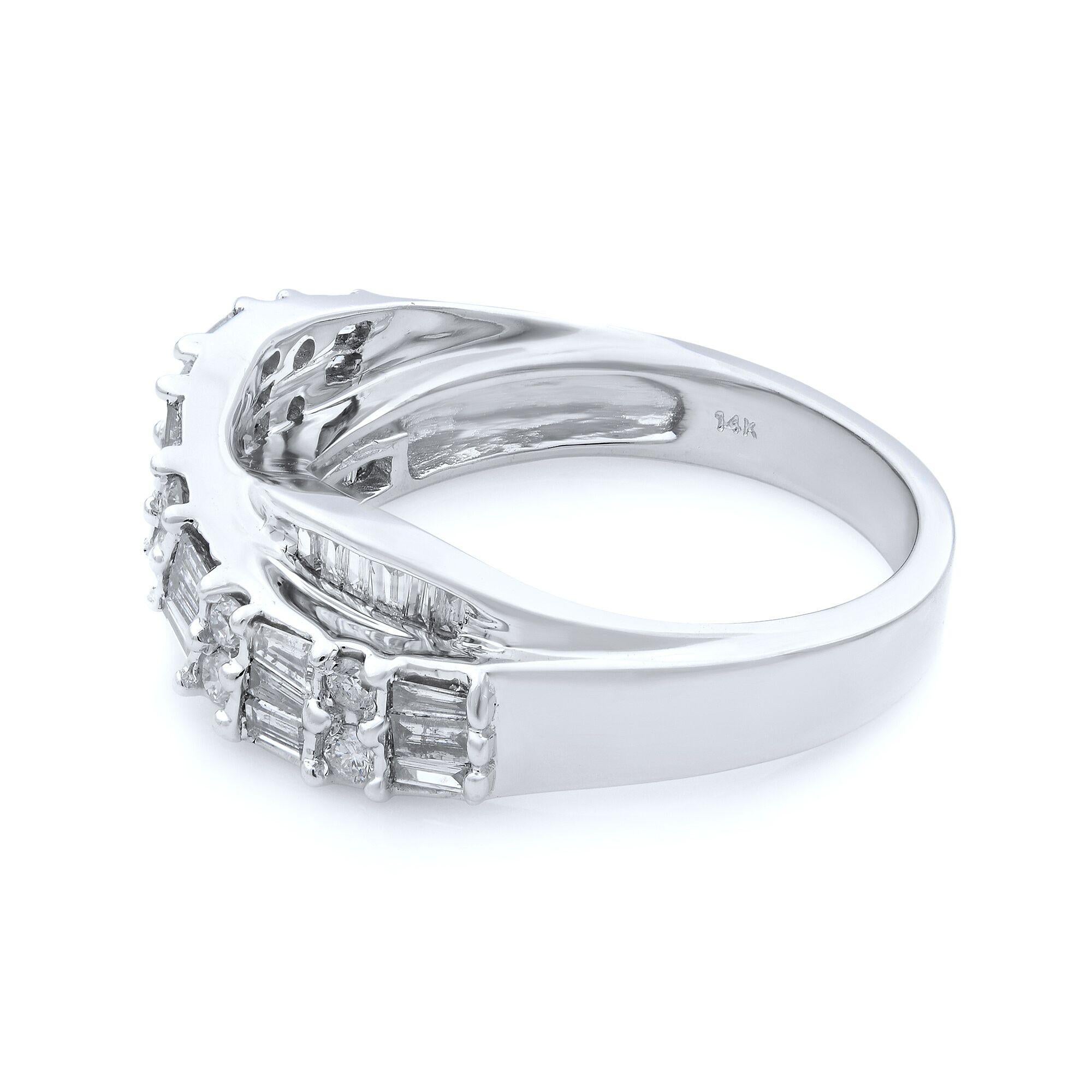 This diamond band containing 1.00cttw of baguette and round cut diamonds is set in 14K white gold. The diamonds are VS1 clarity and J color. The band features an infinity twist for a unique look. Ring Size 7. Comes with a presentable gift box. 