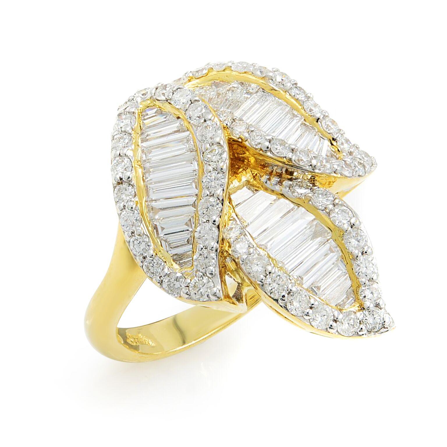 This exemplary and versatile jewel mounted in 18k Yellow Gold incorporates classic Art Deco geometry with an added dose of mid-20th-century flash. The centerpiece is embellished with fans of tapered baguette diamonds with sparkling round brilliant