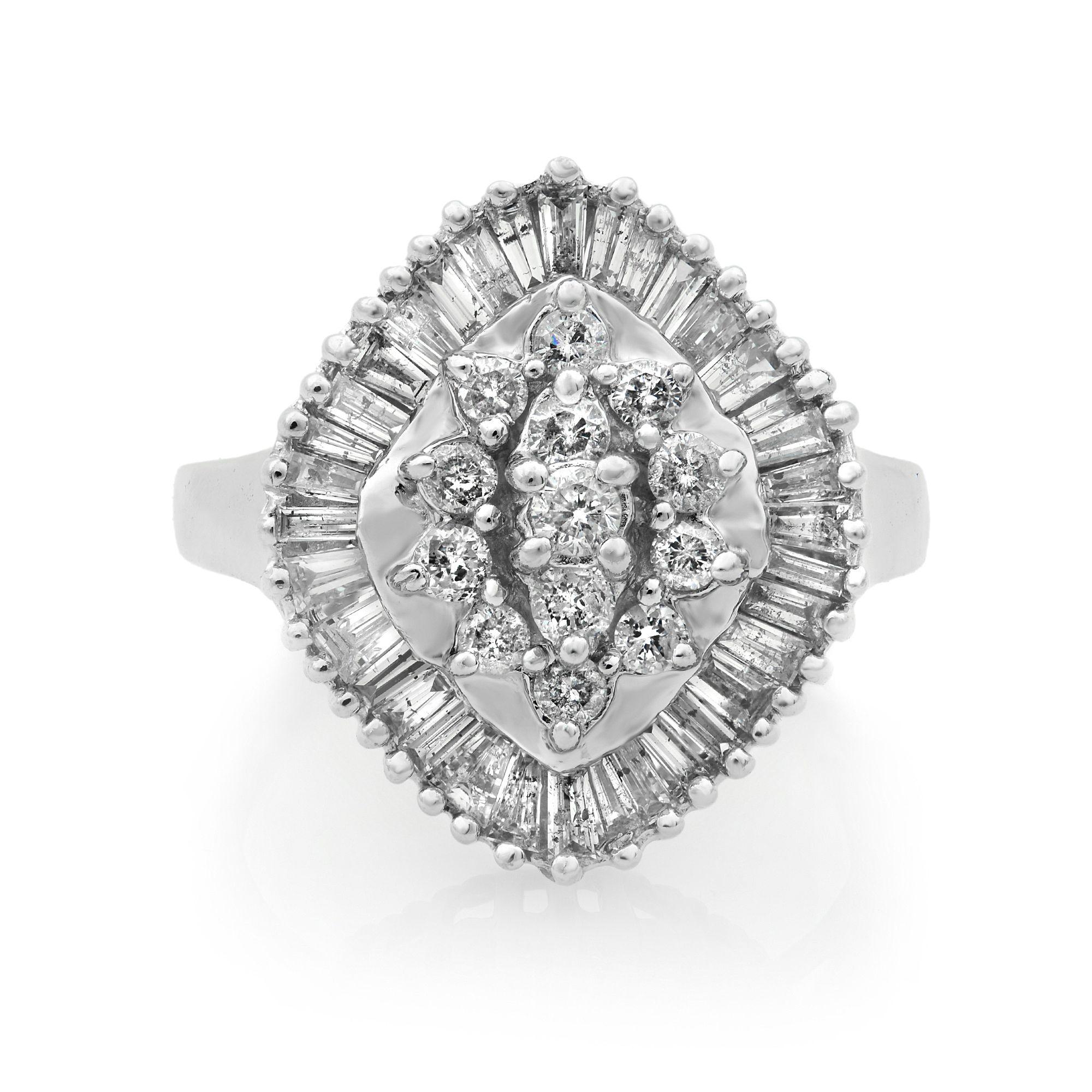 This special diamond cocktail ring embeds pure beauty of uniqueness and elegance. The combination of approximately 2.00 carat of round cut and baguette cut diamonds in G-H color and SI2 clarity set in prong setting are crafted in 14K white gold. Top