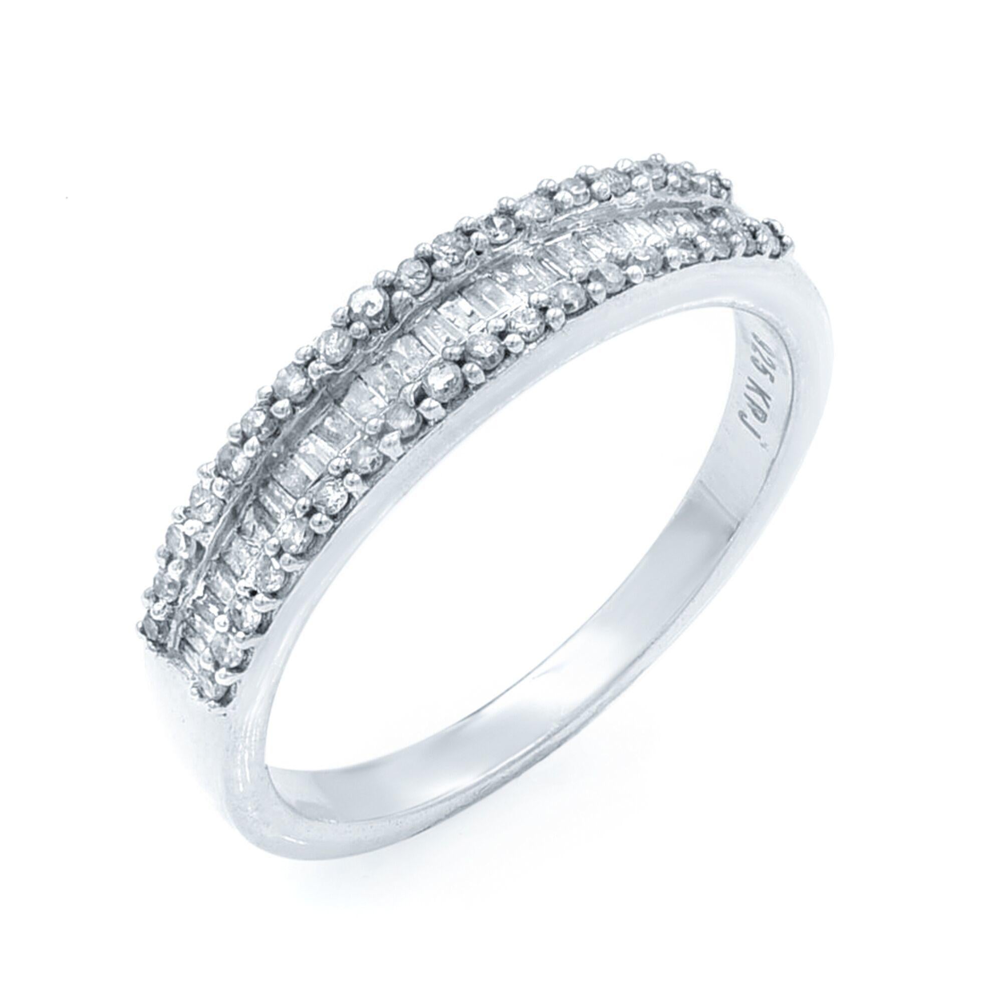This ring is crafted in 925 sterling silver and features 1.00 Cttw of round and baguette-cut diamonds. Ring width: 4.9mm. Ring size: 10. The total weight is 3.5gms. Comes with a presentable gift box. 
