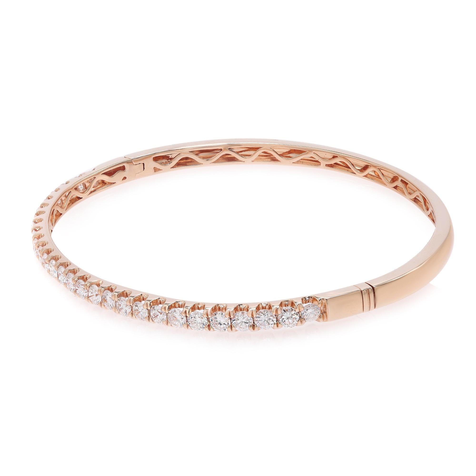 This beautifully crafted bangle bracelet features round brilliant cut diamonds encrusted halfway through the bangle in four prong setting. Crafted in 18k rose gold. Total diamond weight: 2.00 carats. Diamond Quality: F-G color and SI clarity. Wrist