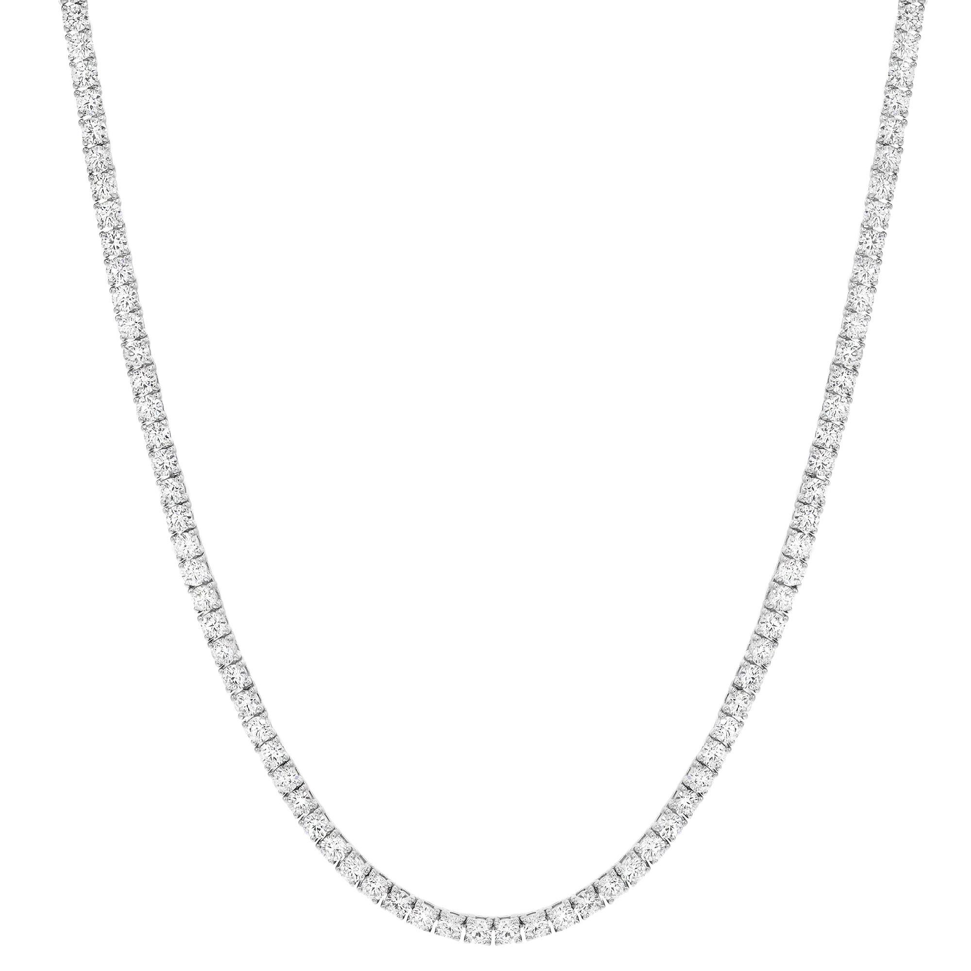 A classic diamond single line tennis necklace is an iconic essential that always remains in fashion. This elegant and alluring necklace features 153, 0.09pt prong set bright white round brilliant cut diamonds weighing 13.63 carats in total. Diamond