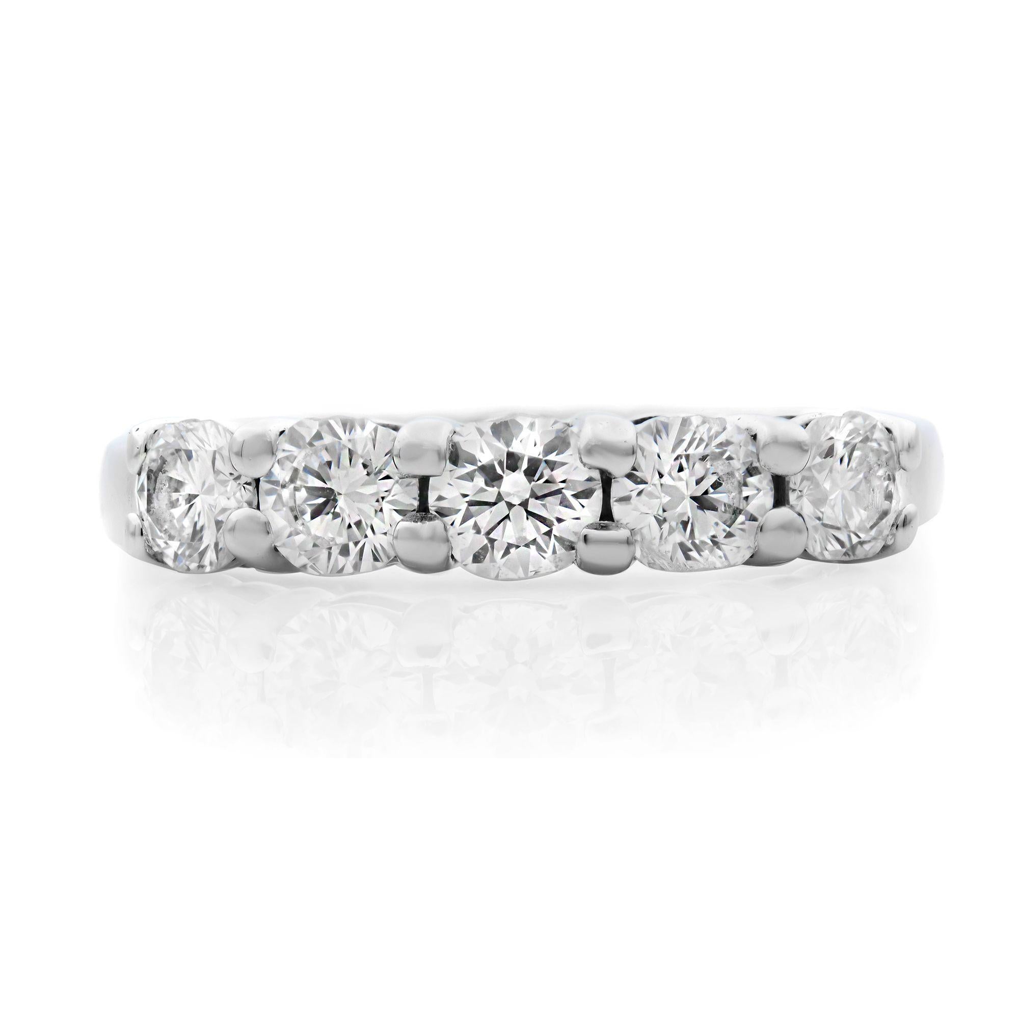 This gorgeous diamond band is crafted in elegant and durable platinum, this timeless wedding band is bedecked with 5 round diamonds in a shared prong setting. Width of the ring 3.50mm. Ring size 6. Pre-owned condition. Approx. diamond carat weight