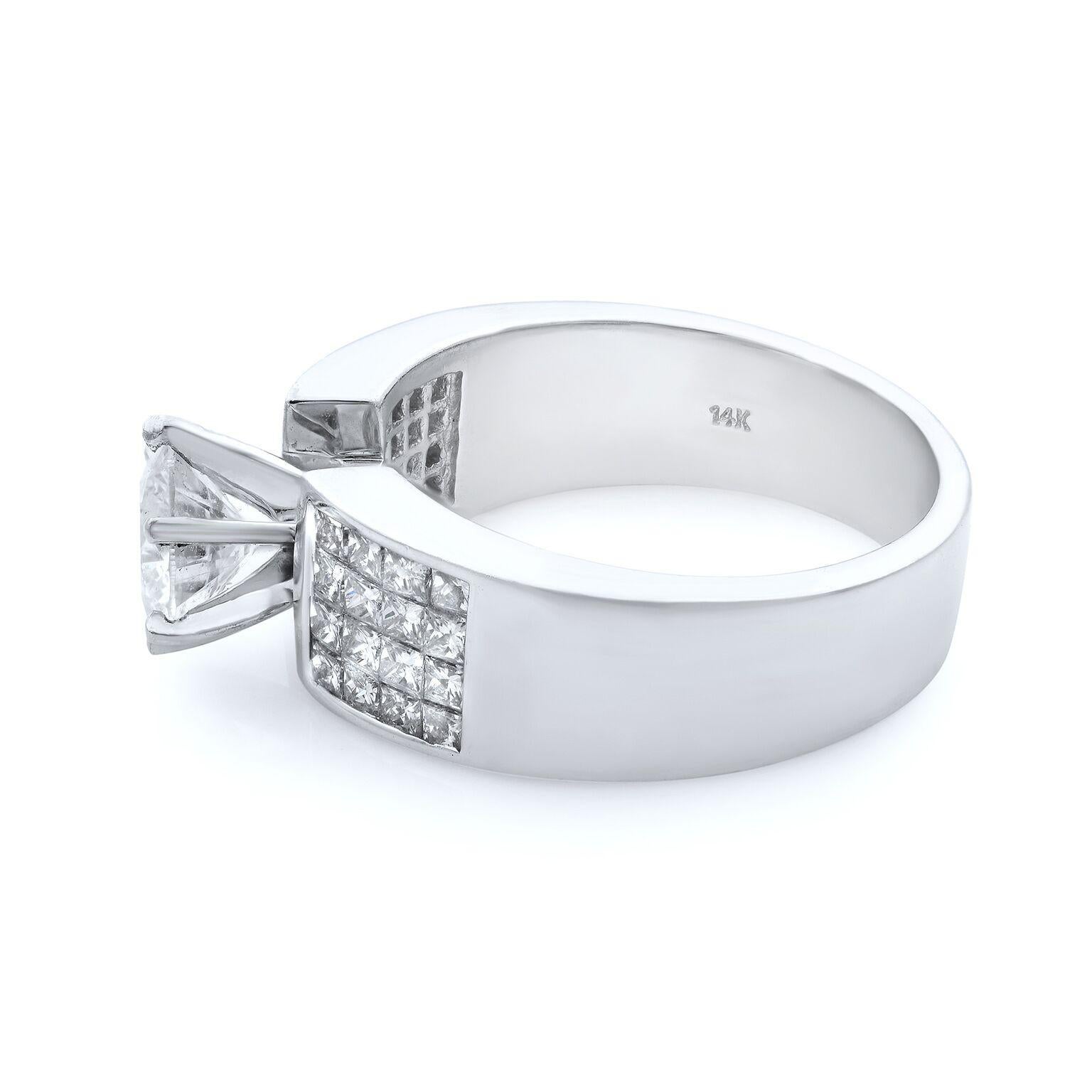 This classic wedding setting exudes elegance and brilliance with 14k princess cut channel set diamond shank with a round cut center diamond. Each diamond has been hand-selected for superior sparkle and is channel-set in quality. Total carat weight