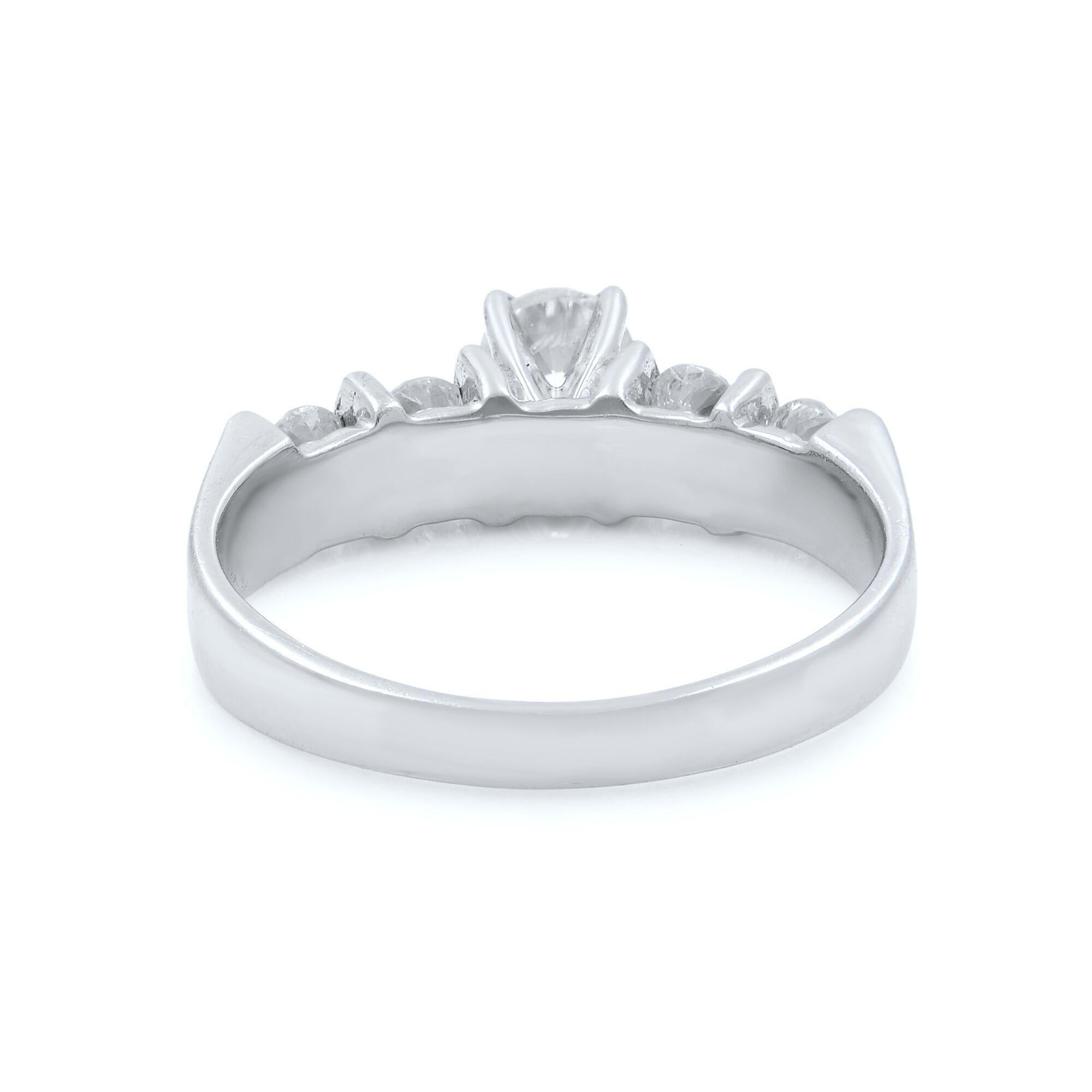This beautiful diamond engagement ring is crafted in 14K white gold. It features a center round cut diamond with 4 round cut diamond accents. Total diamond weight: 0.86ct. Ring size 7. Total weight: 4.3 gms. Comes with a presentable gift box and an