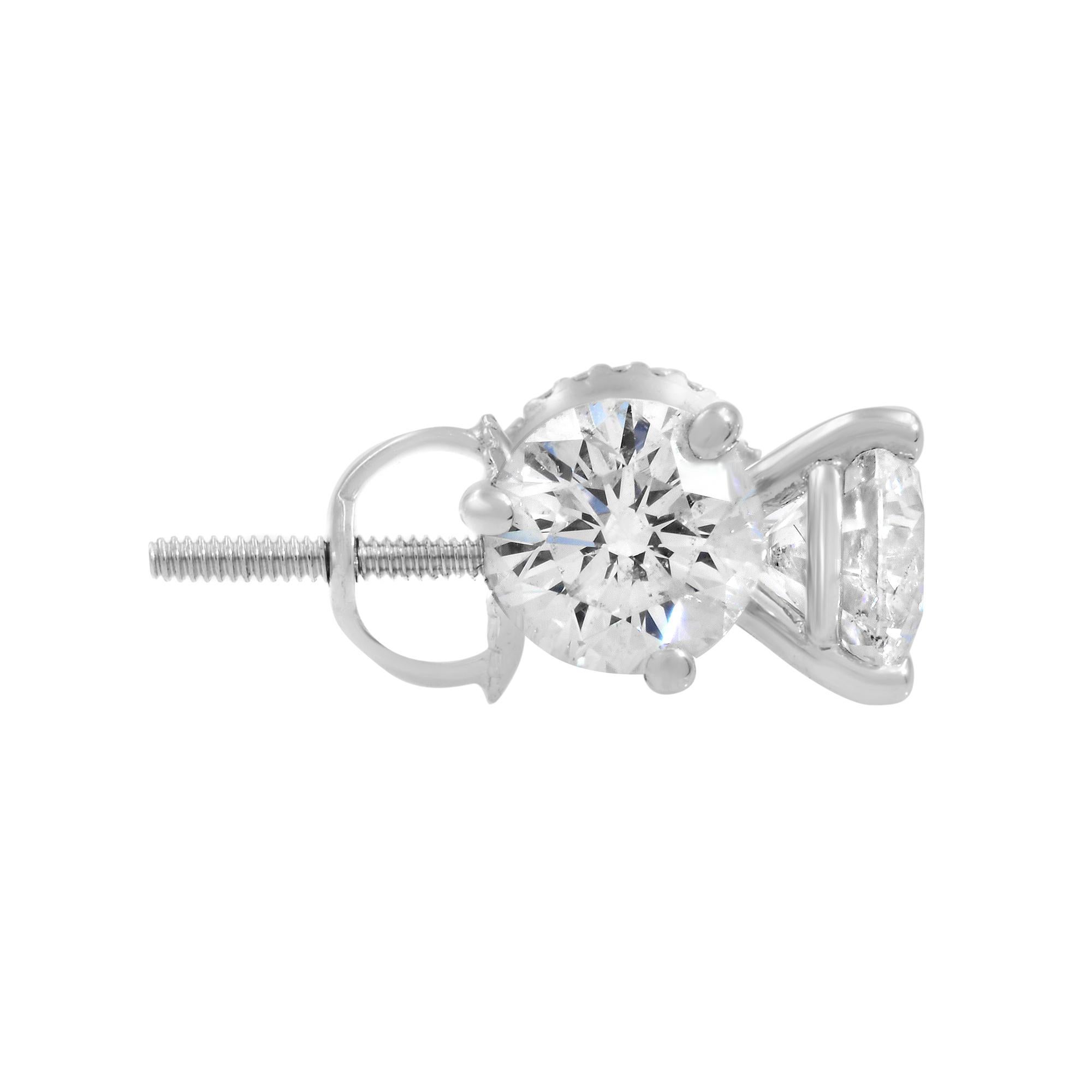 These round cut diamond stud earring are crafted in 14k white gold, set in iconic solitaire 3 prong settings casting. Each diamond is crafted to the highest standards and inscribed with an invisible mark of quality. Each diamond is 0.75 carat. Total