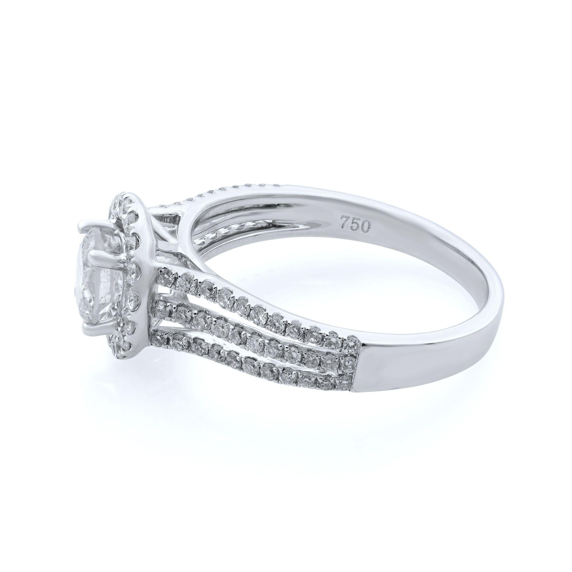 14k White Gold 0.60 carat round cut diamond three row split shank halo engagement ring. Split shank divided into three rows, each pave set with brilliant white diamonds, hoists up the center mounting surrounded by a halo of radiant tiny diamonds.