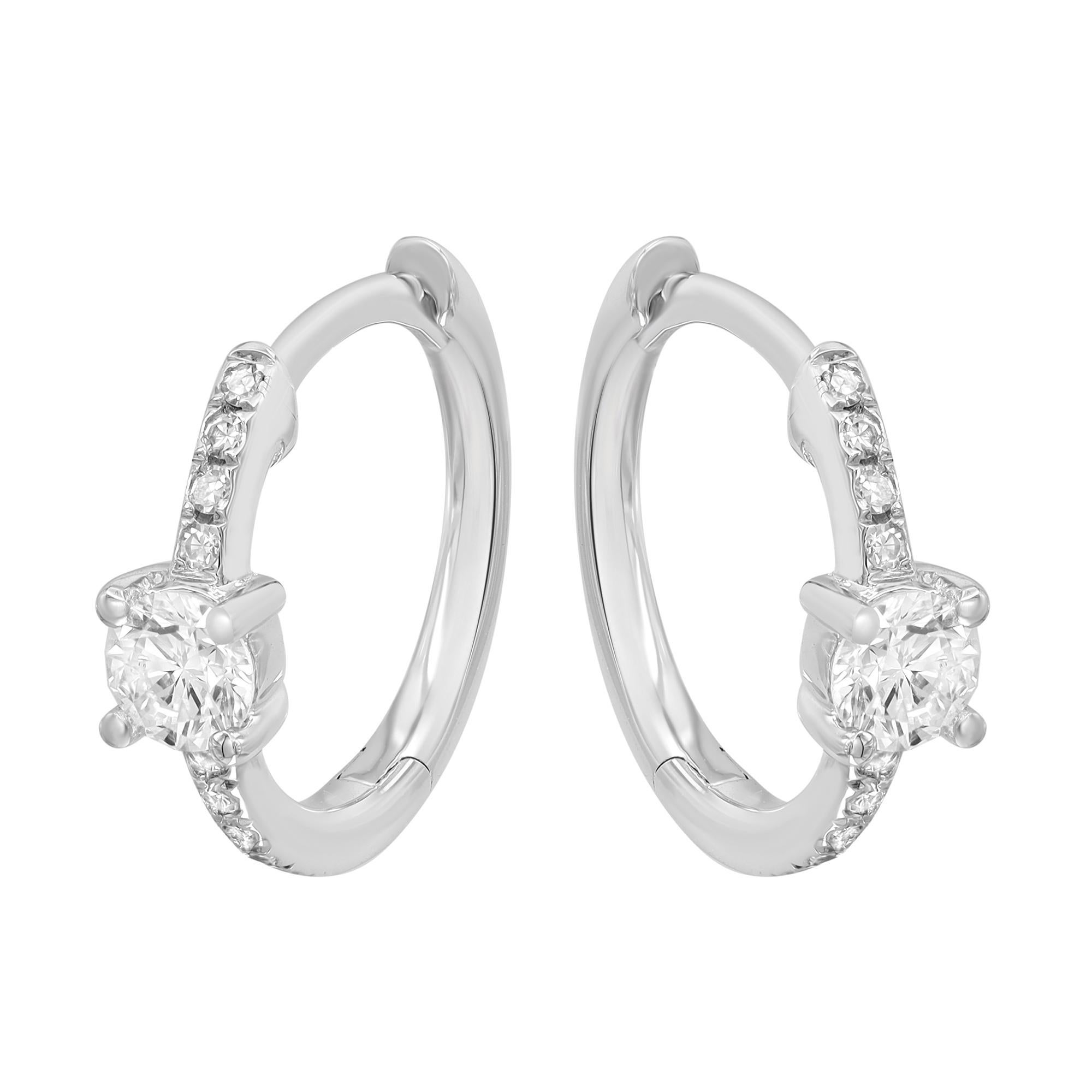 Dainty and dazzling diamond round Huggie earrings, perfect for a great everyday look. These earrings are crafted in fine high polished 14K white gold and encrusted with bright white round cut diamonds weighing 0.25 carat. Diamond color G-H and