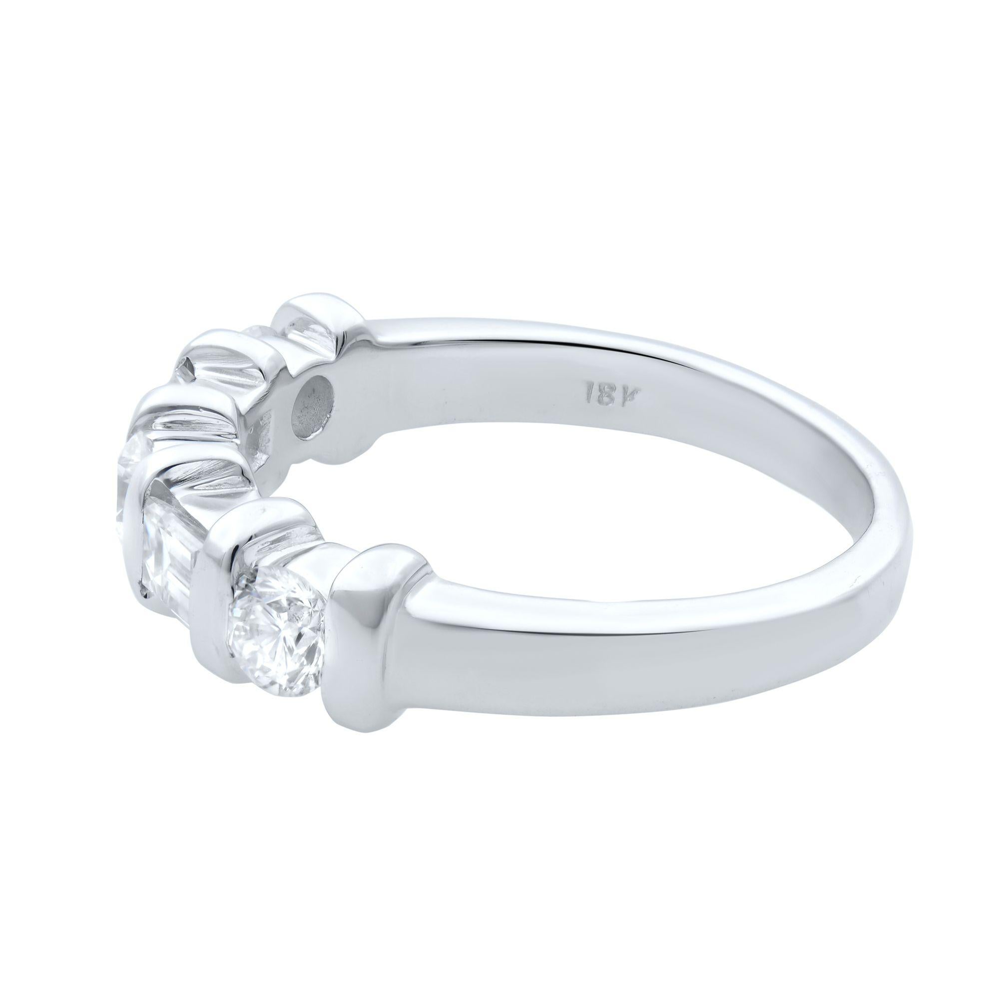 Beautifully crafted 18K white gold wedding band ring with round and emerald cut diamonds. Total diamond carat weight is 0.50. Diamonds are VS1 clarity and G color. Width: 4.85 mm. Ring size 5.75. Comes with a presentable gift box. 
