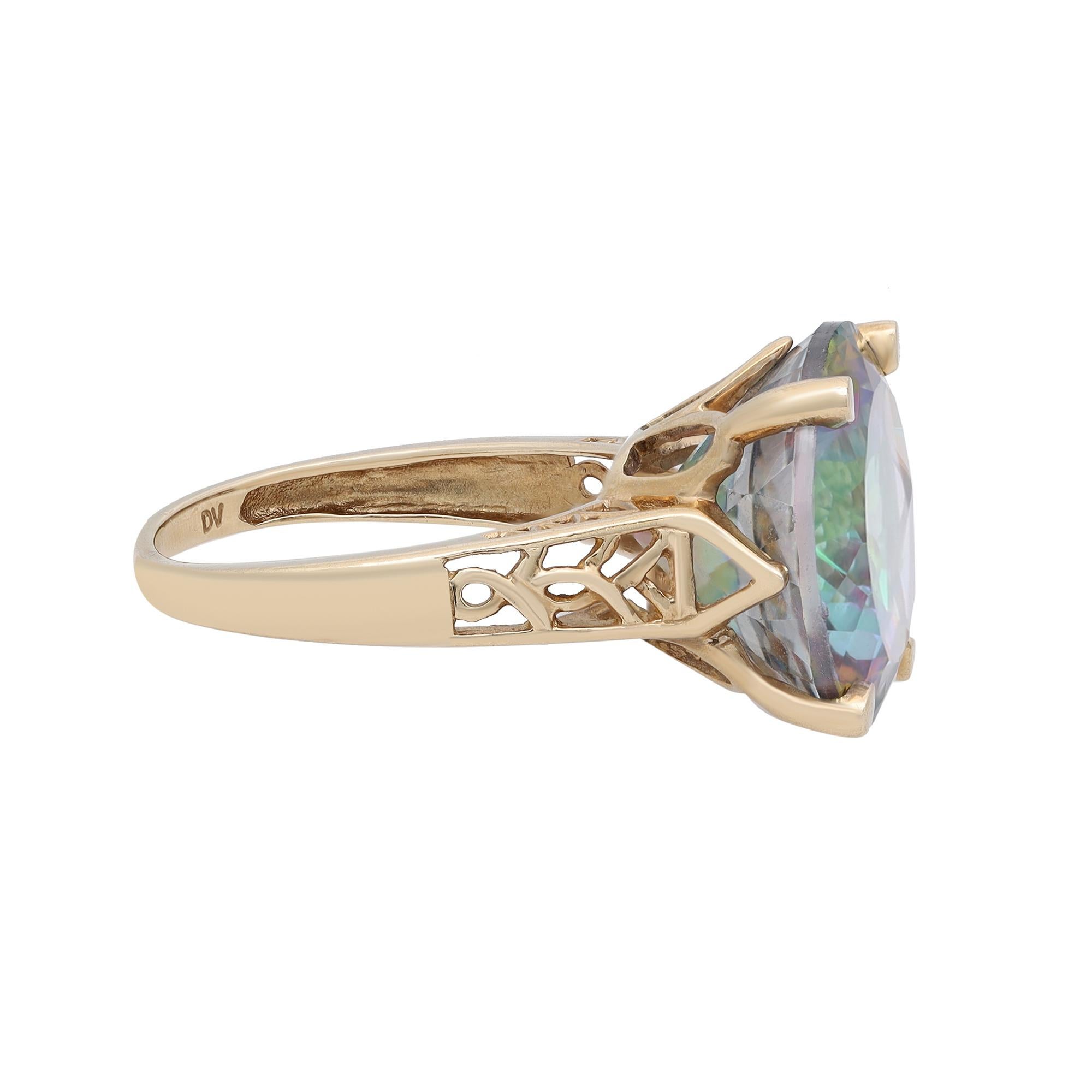 This lovely ring features a prong set round shape mystic rainbow Topaz set in a 10k yellow gold band with a filigree mounting design visible from the sides. It would make a beautiful promise ring, a unique engagement ring, or a wonderful gift for