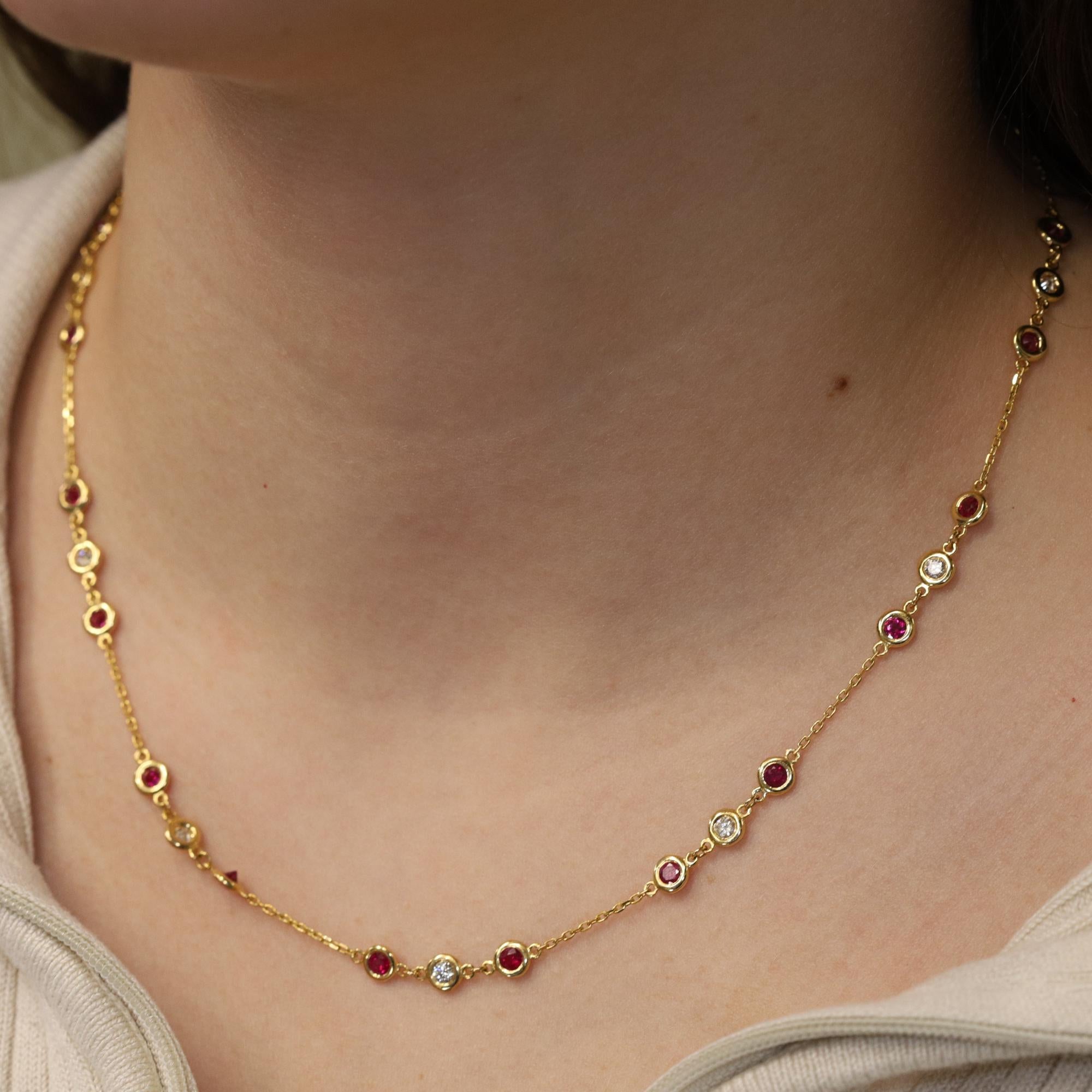 Bezel set stations of richly hued rubies and dazzling round cut diamonds enliven this shimmering 14k yellow gold necklace. Rubies total weight: 2.86ct. Diamond total weight: 0.95ct. Chain length: 18 inches. Comes with a presentable gift box and