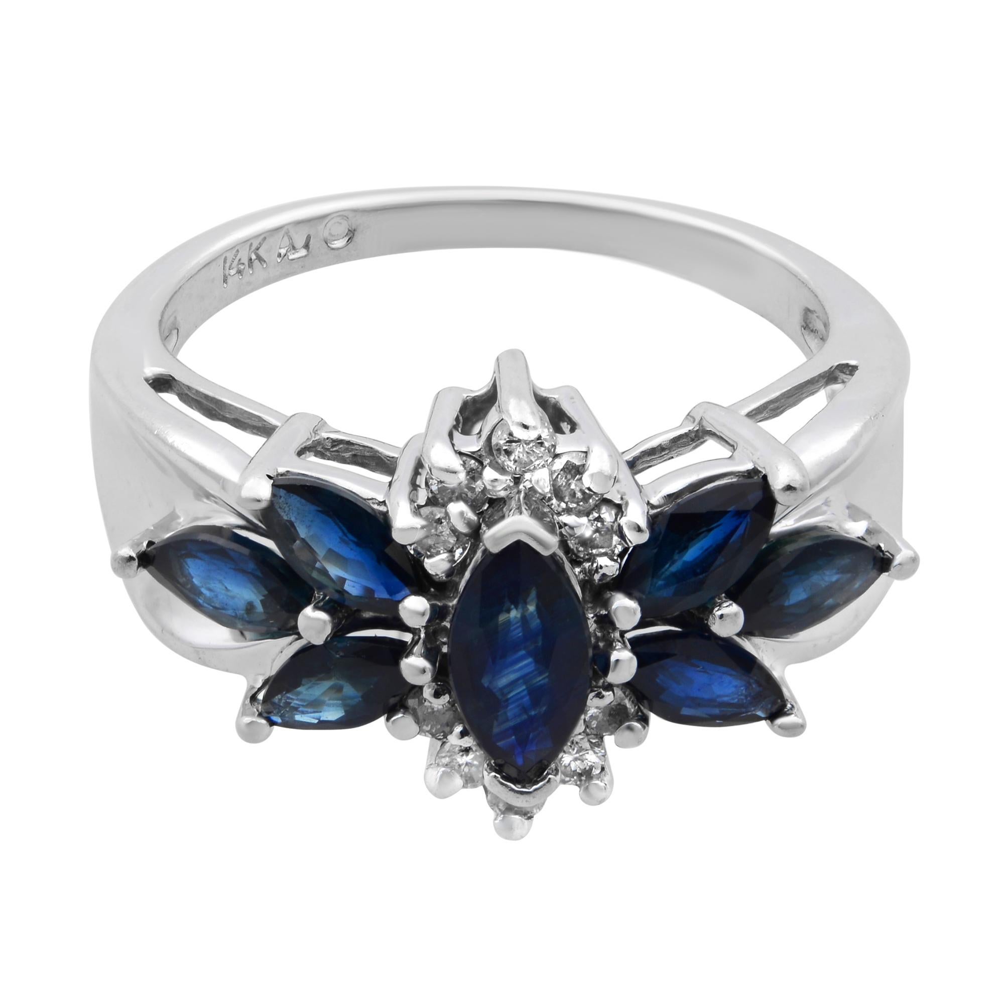 This beautiful ladies cocktail ring is crafted in 14K white gold. It features 7 marquise cut blue sapphires weighing 1.00 carat and flanked with 10 round cut diamonds weighing 0.10 carat. Ring size 7. Total weight: 4.30 grams. Unworn condition.