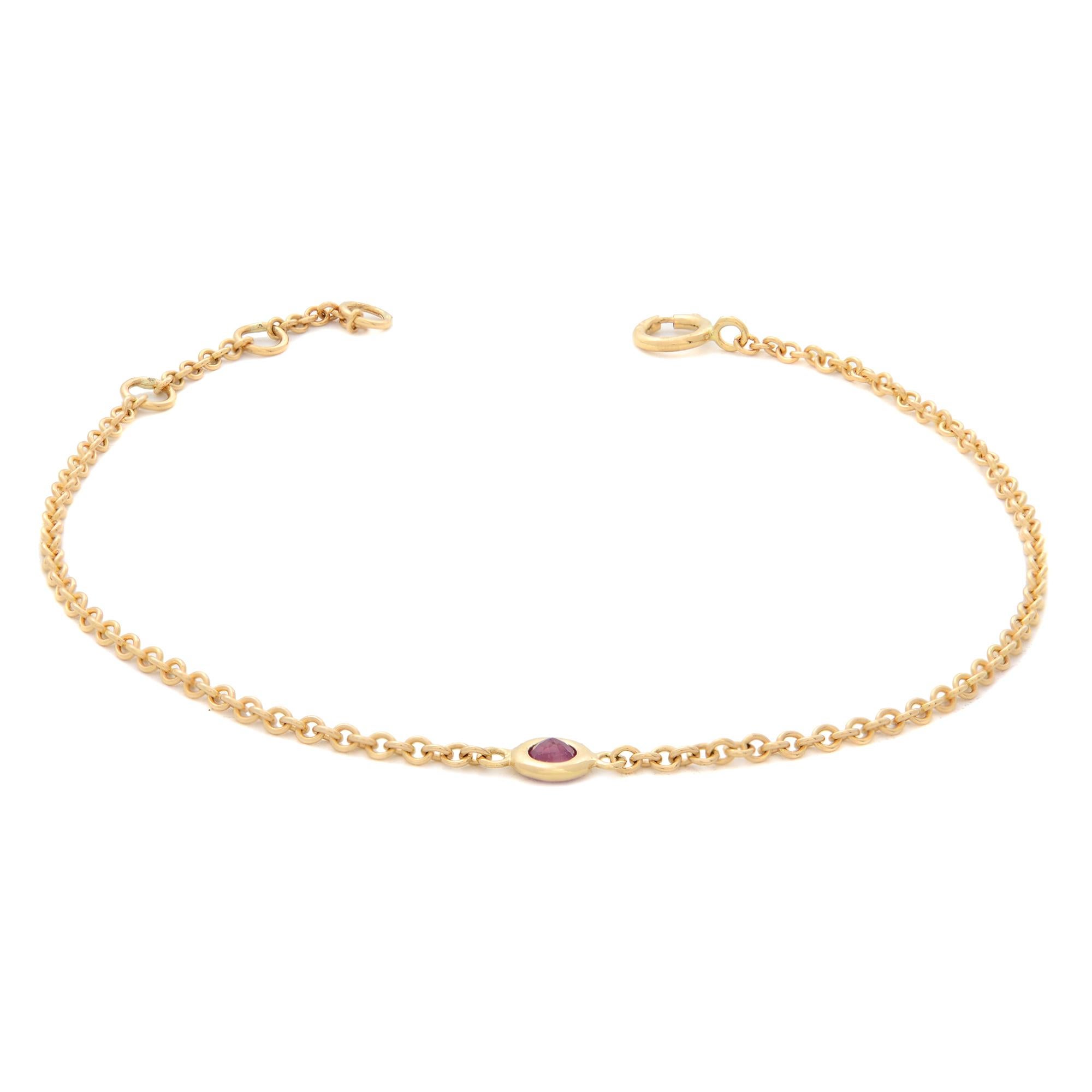 This 14k yellow gold bracelet features a delicate chain with a bezel set round cut Pink Ruby charm. Tiny 15pt natural Ruby. July birthstone. Bracelet length: adjustable from 6.25-7.25 inches. We used the finest quality materials and utmost care to