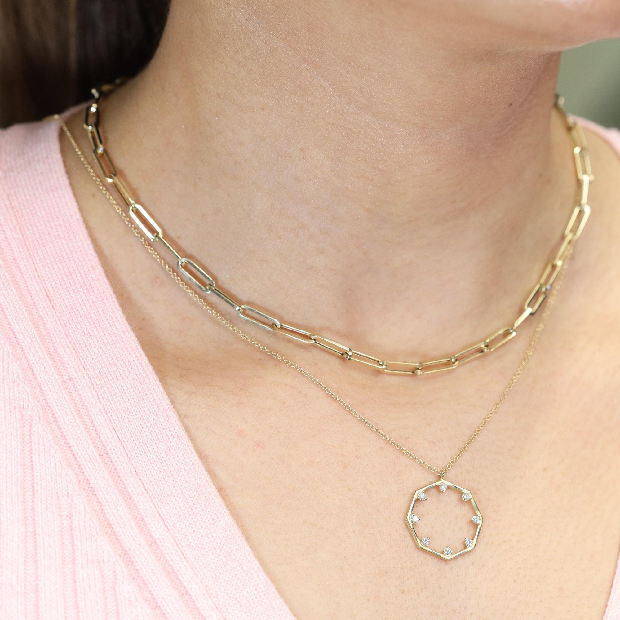 Trendy and lightweight for an everyday look. This paper clip link chain necklace is crafted in 14k yellow gold. Length: 18 inches. Link Size: 11.75mm x 3.75mm. Weight: 6.30 grams. Closure: Lobster lock. Whether you layer up or wear it solo, you are