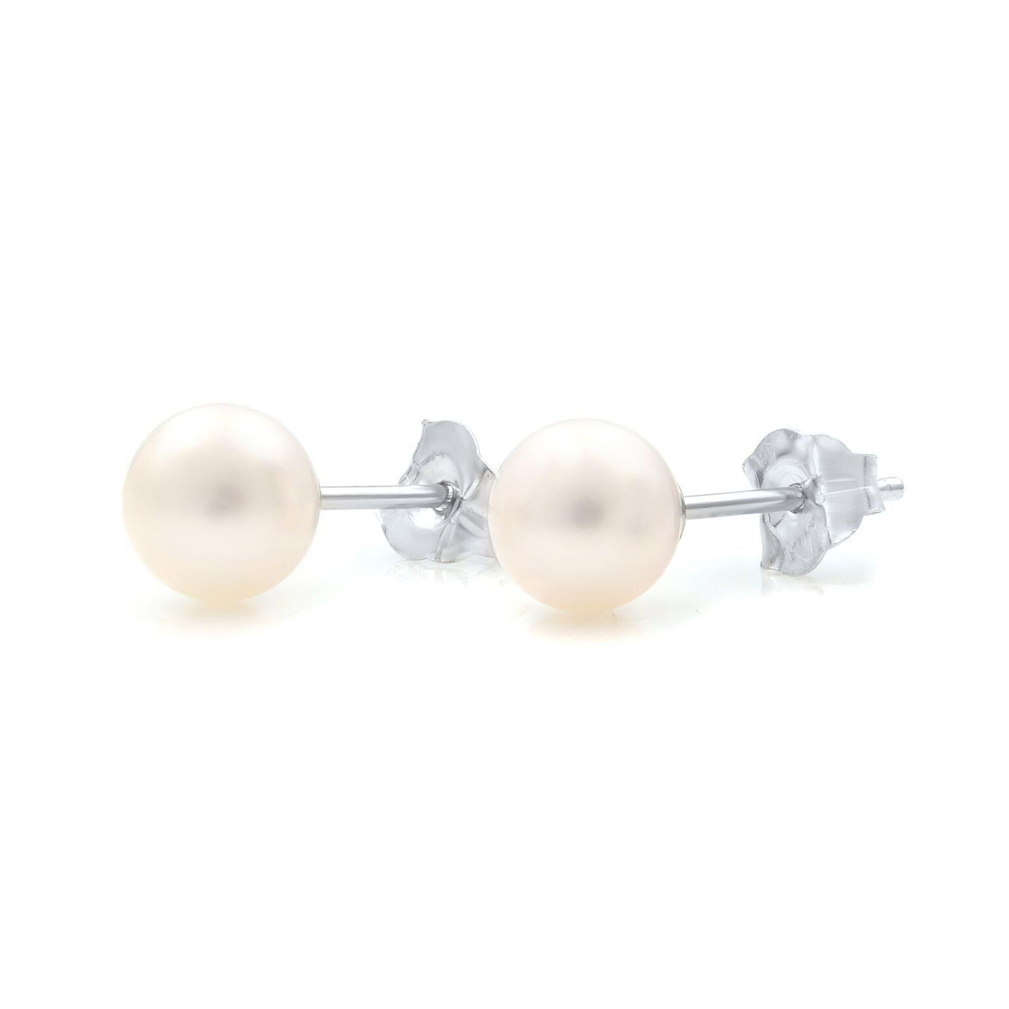 Beautiful and classic small white Pearls stud earrings which are set in 14K white gold. Natural white freshwater pearls. Push backs. Each pearl is 5mm. Comes with a presentable gift box.