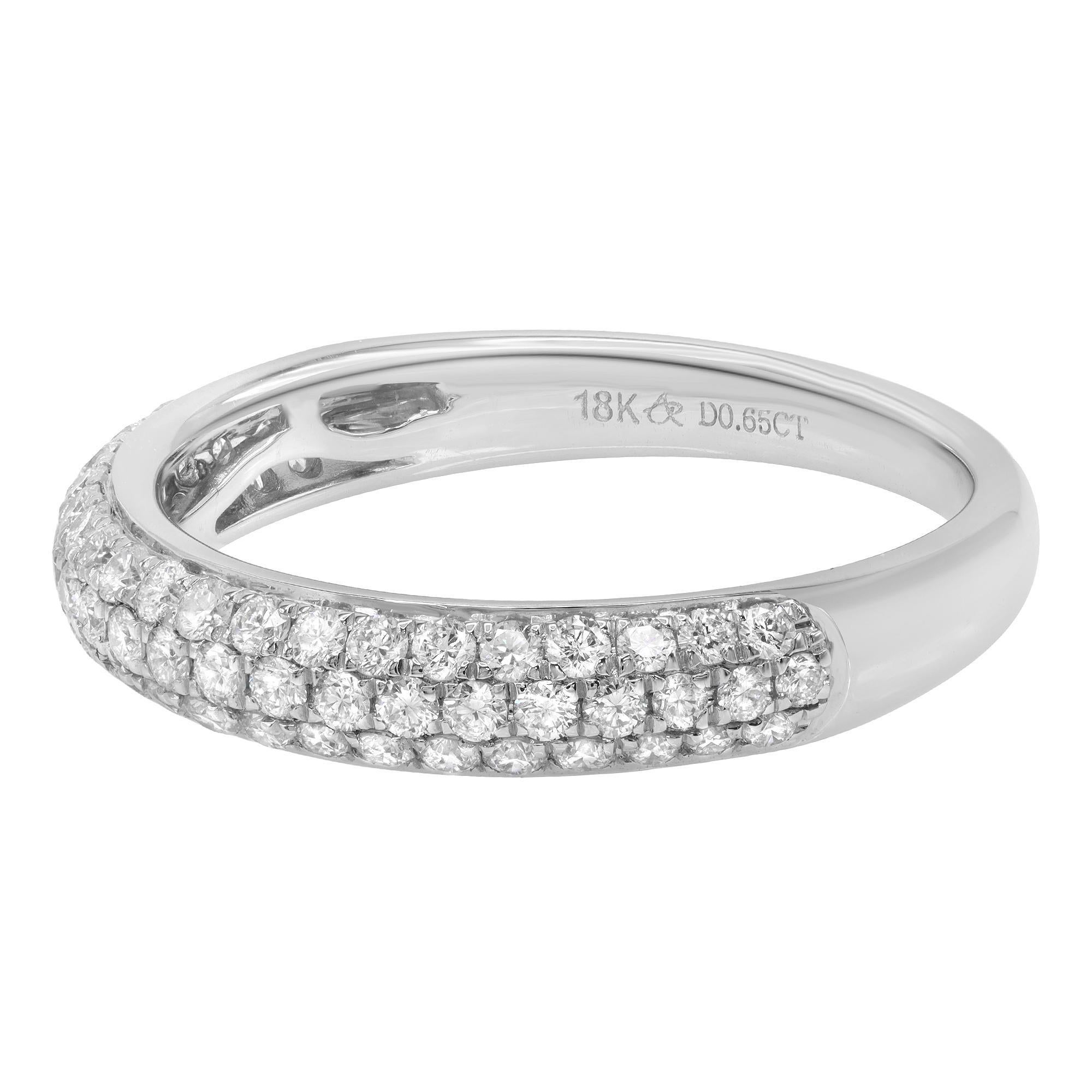 This stylish diamond band features three rows of round brilliant pave-set diamonds. Currently priced with diamonds going half way around the band, totaling 0.65cttw. Diamond color I and SI-I clarity. The ring is crafted in 18k white gold. Ring size
