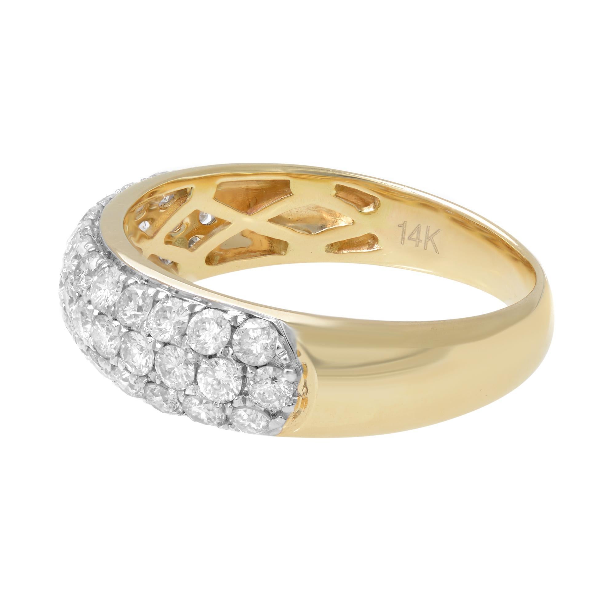 This stylish diamond band features three rows of round brilliant pave-set diamonds. Currently priced with diamonds going halfway around the band, totaling 1.04cttw. Diamond color G and VS clarity. The ring is crafted in 14k yellow gold. Ring size