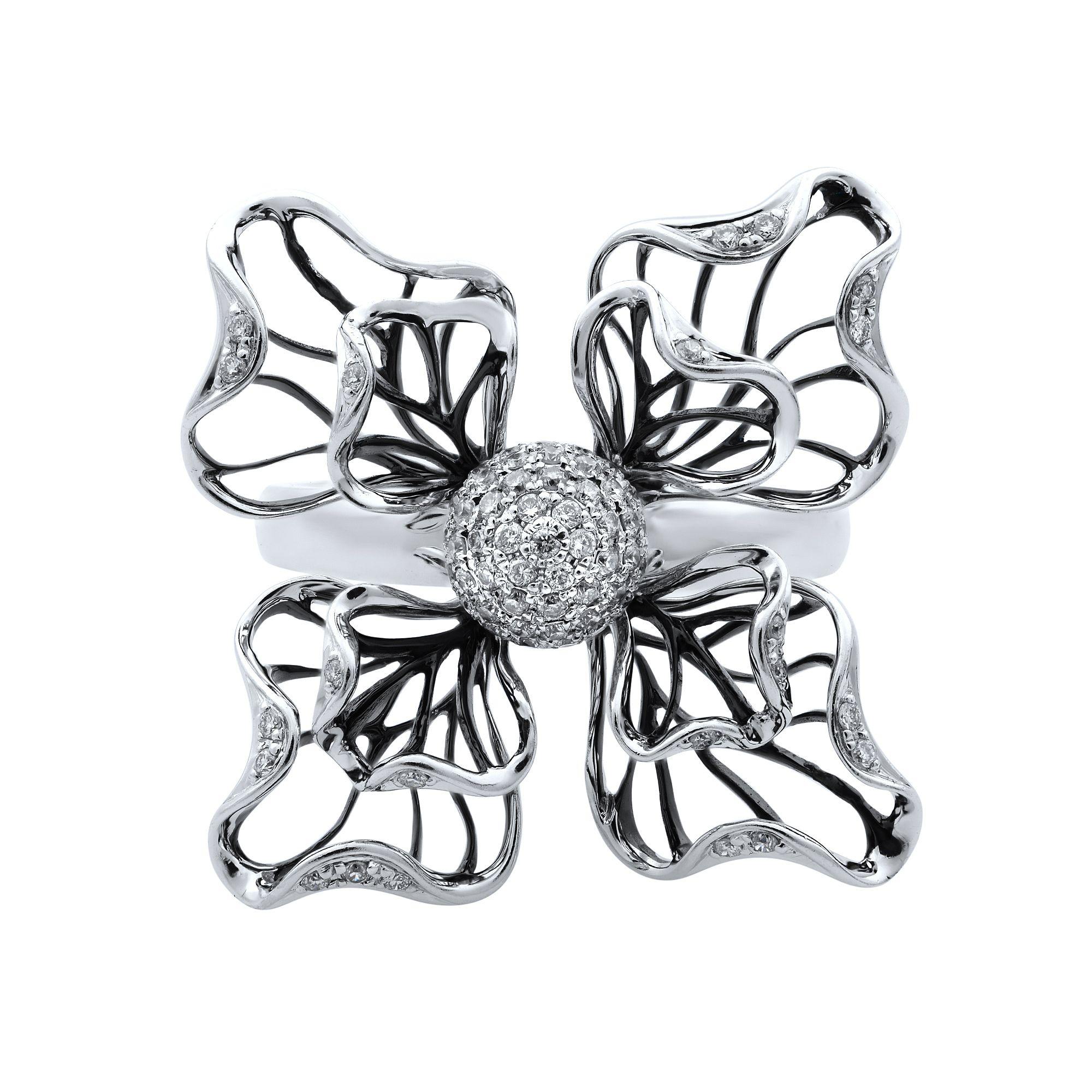 A beautiful unique vintage 18k white gold black rhodium flower cocktail ring, set with 0.35ct of round cut diamonds. Weight: 6.80 g. Ring Size 7. Come with a presentable gift box. 