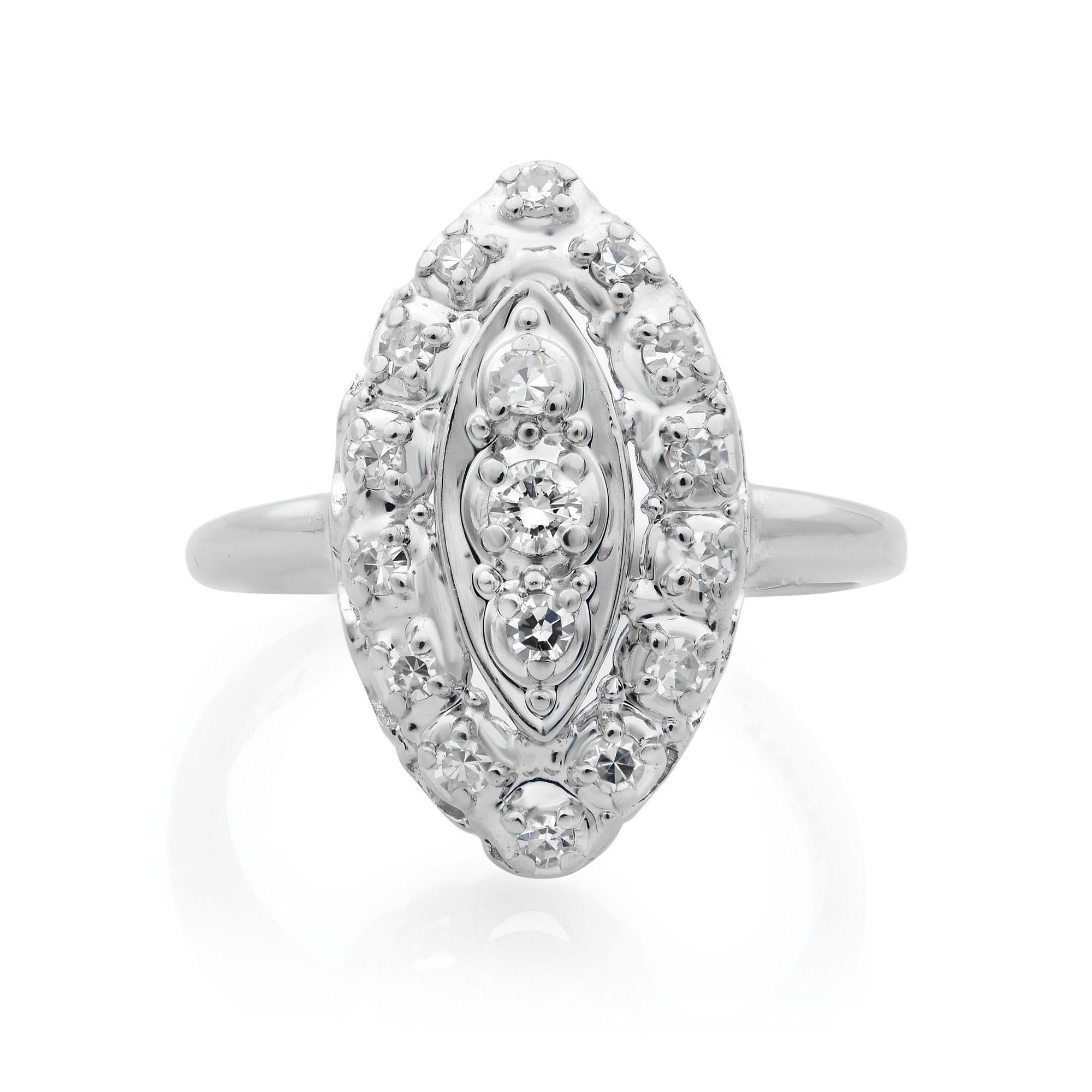 One of a kind vintage ring. The metal of the ring is 14k white gold and the diamonds are placed in a marquise shape in a prong setting which gives the ring a Victorian era look. The eye cannot distinguish between what is a diamond and what is the