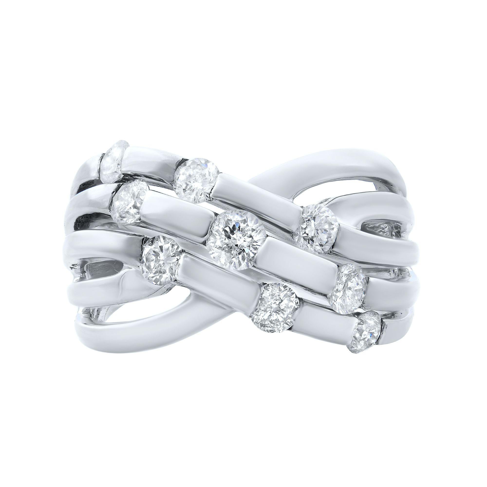 This is a triple row of diamonds ring that wraps around the finger like a celestial beauty.The sparkling diamonds are nestled in channel setting. Ring Size 7.
Total carat weight 1.00. 
Diamond Color J
Diamond Clarity VS1-VS2
Metal: 14K White Gold 